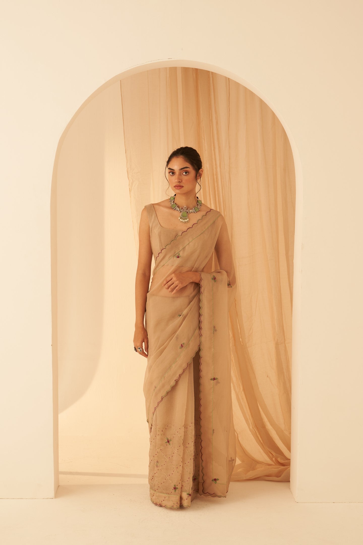 Champagne organza zardozi & elegant resham jaal work saree paired with an organic cotton stitched petticoat