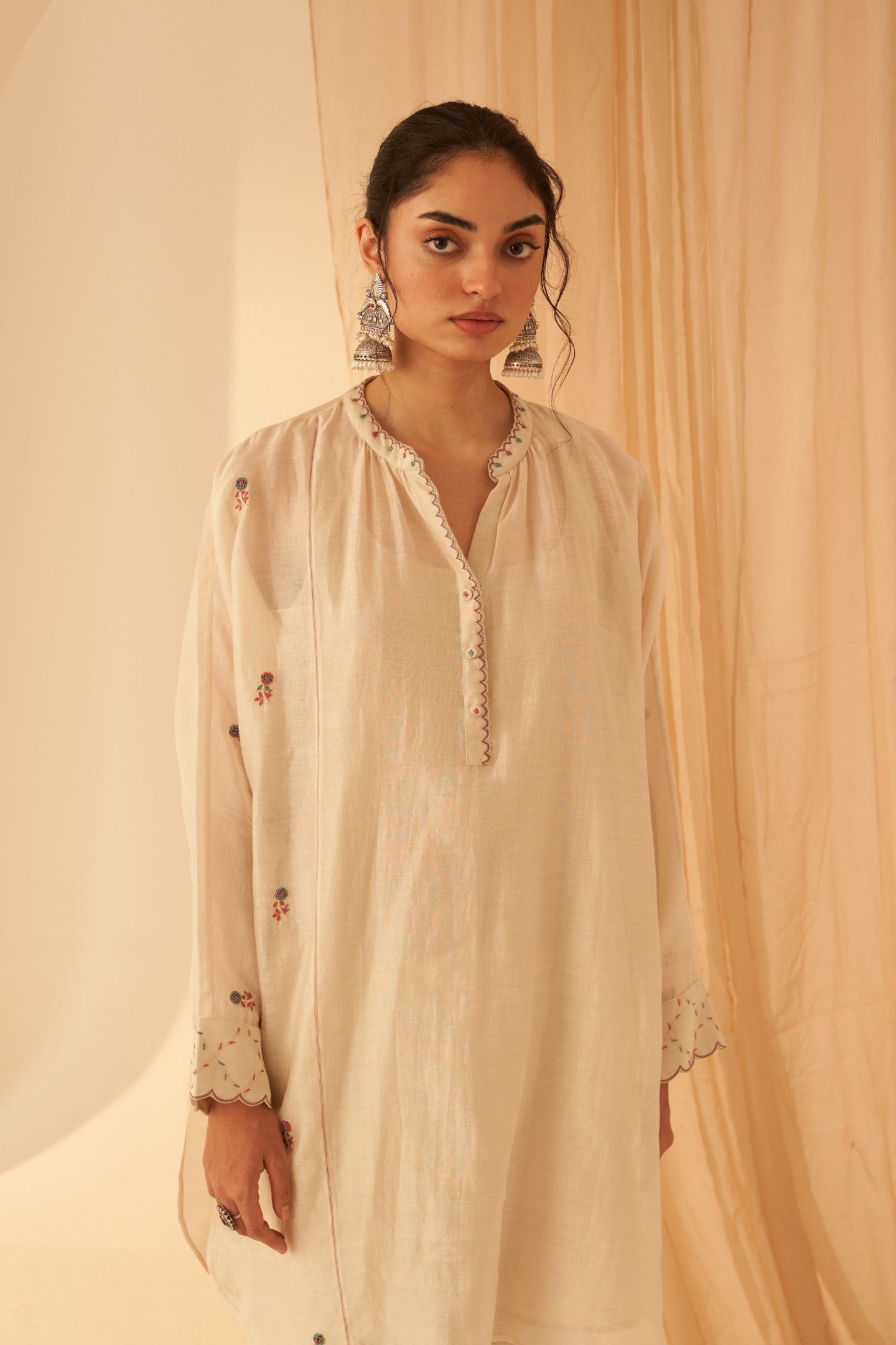 Ivory Chanderi tunic with bullion work, jaal on kurta sleeves paired with cotton slip & afghani salwar