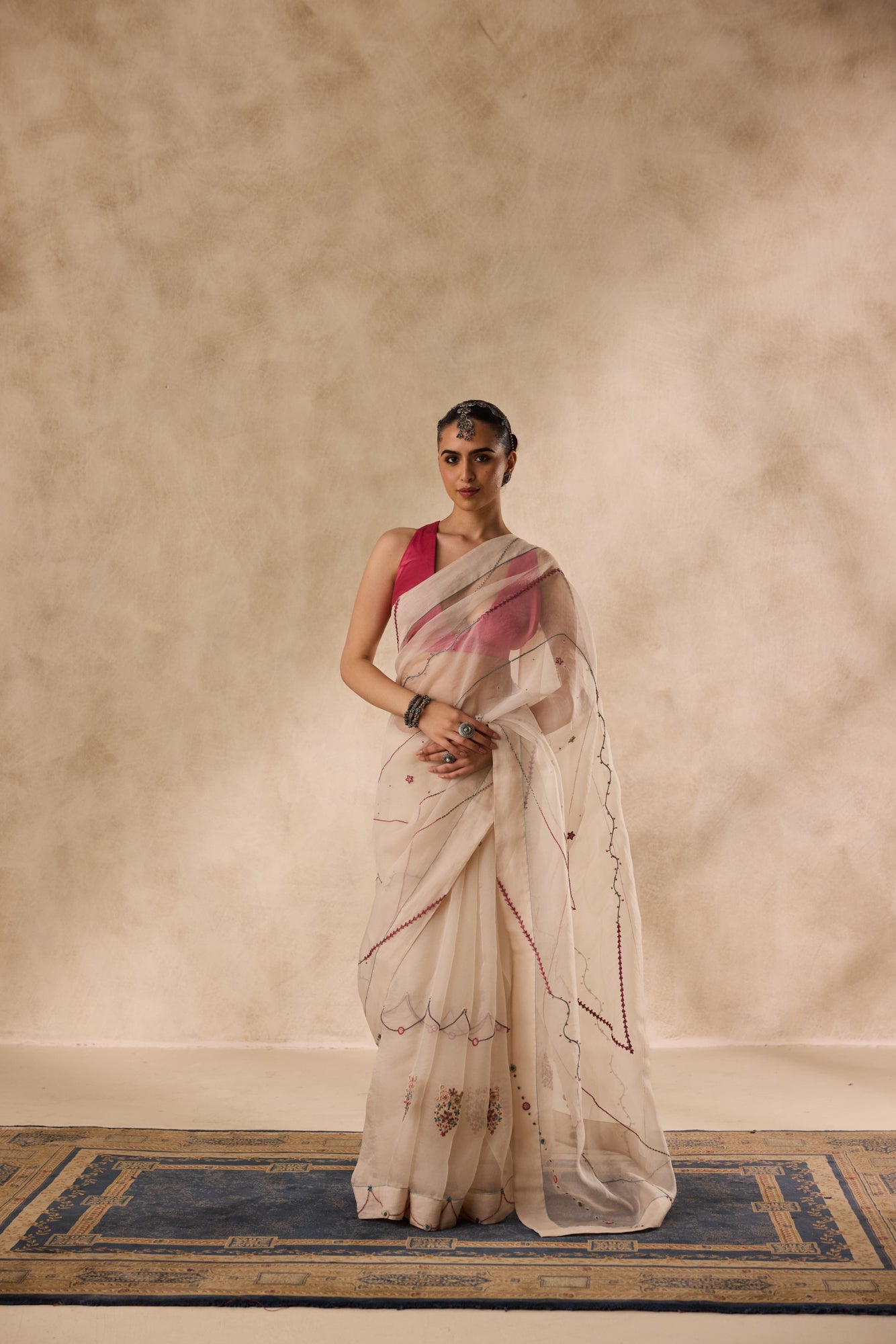 Ivory organza french knot jaal & paisley work saree comes with unstitched & unembroidered blouse fabric in chanderi