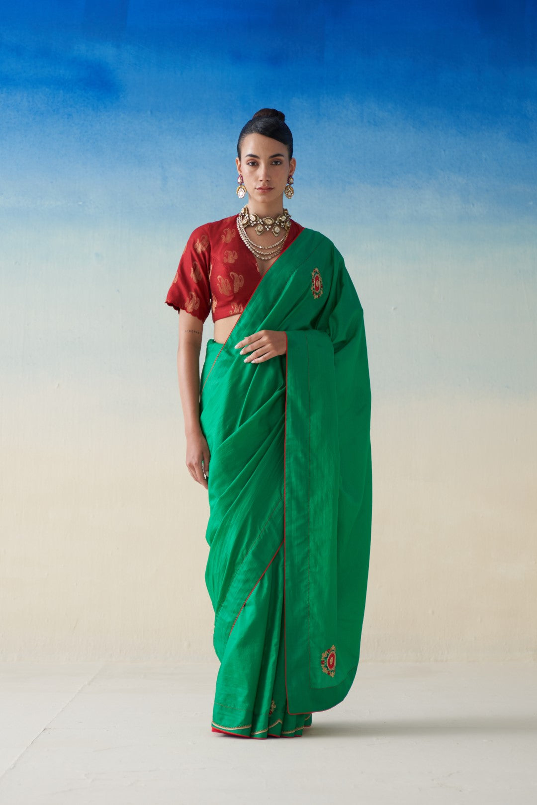 Green silk saree with embroidered motifs comes with an organic cotton stitched petticoat (02 Pcs.)