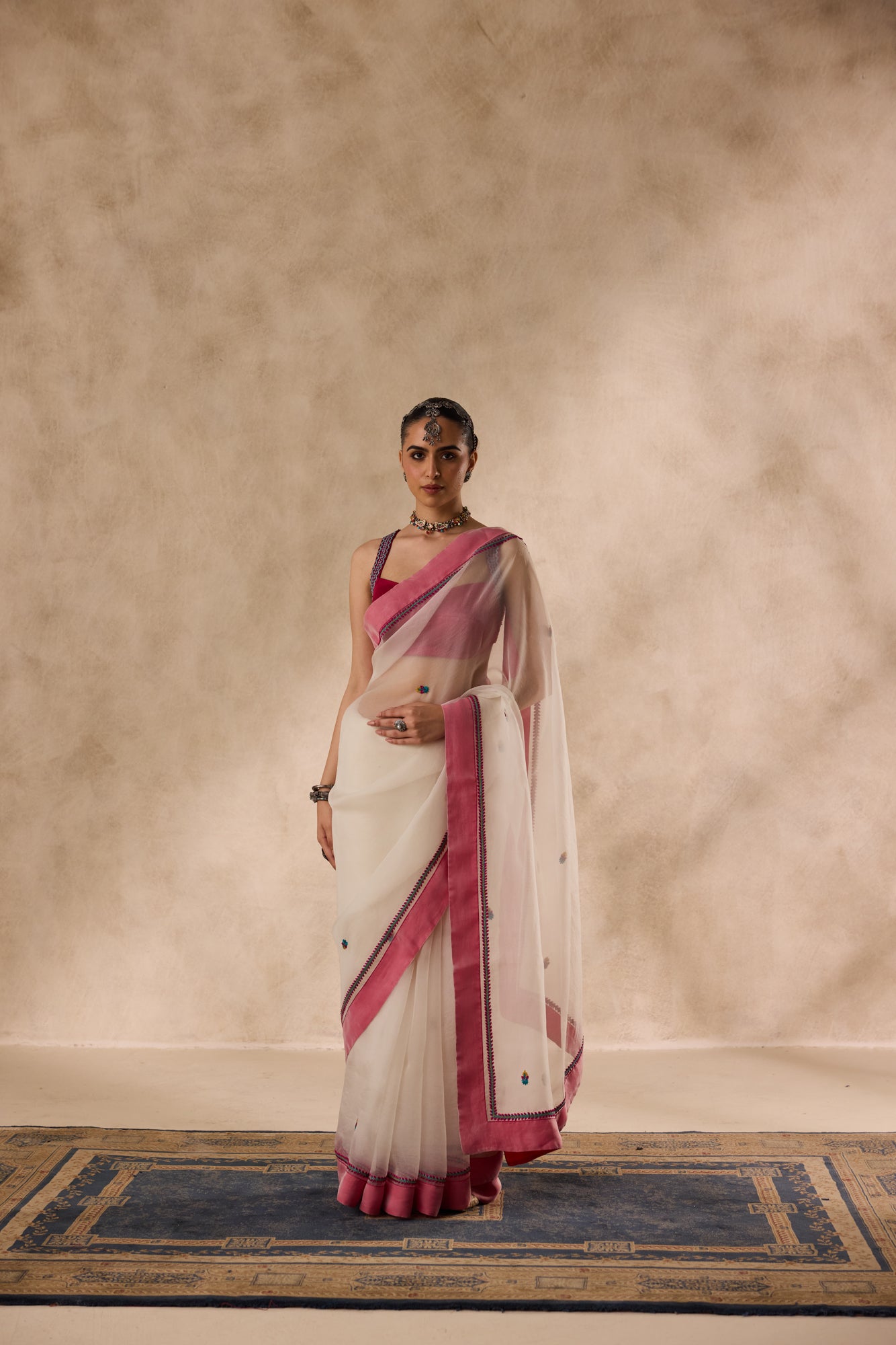 Ivory organza rasham buti embroidered saree comes with unstitched & unembroidered blouse fabric in chanderi
