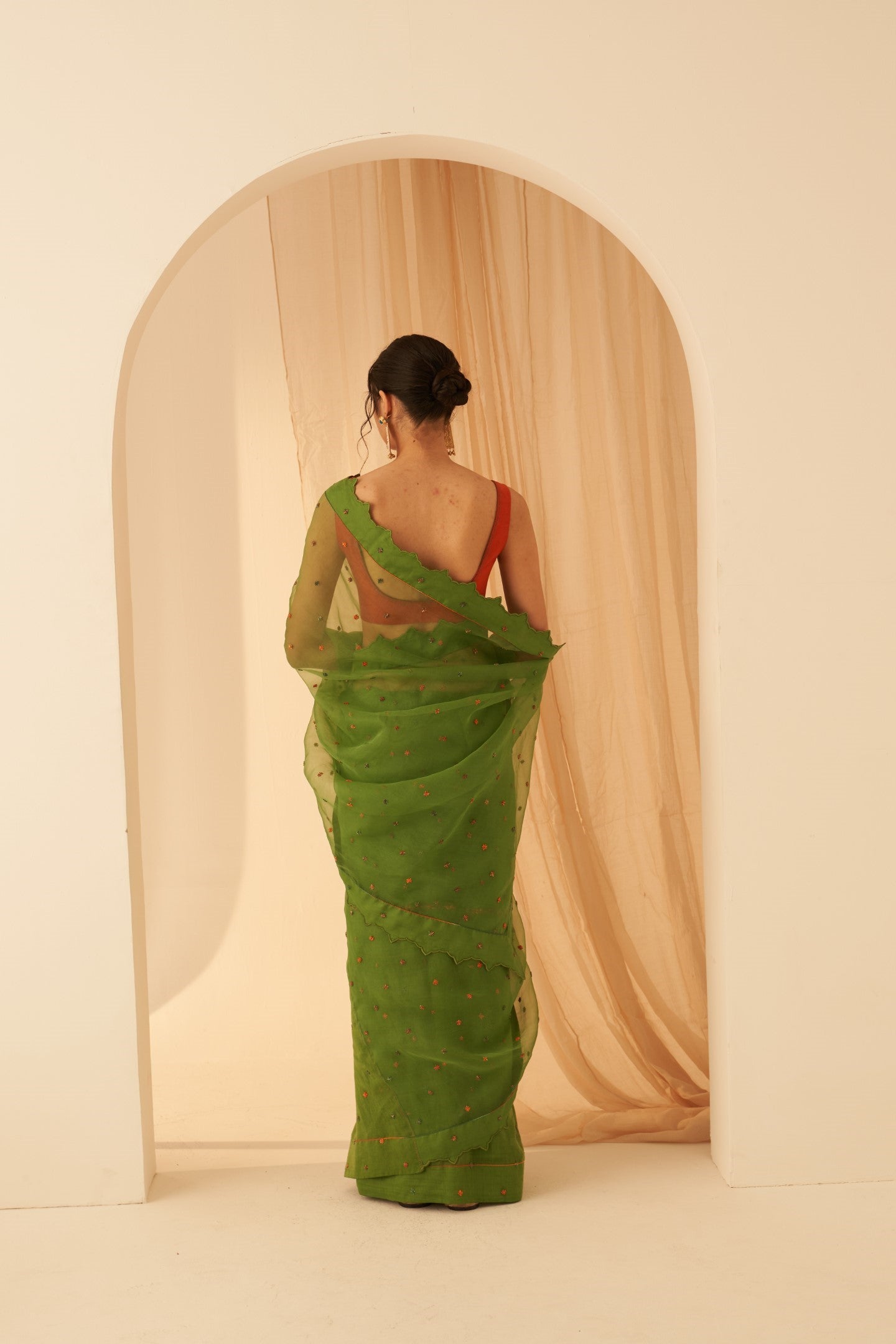 Green chanderi-organza  embroidered with cross taanka work, scalloped border saree paired with an organic cotton stitched petticoat