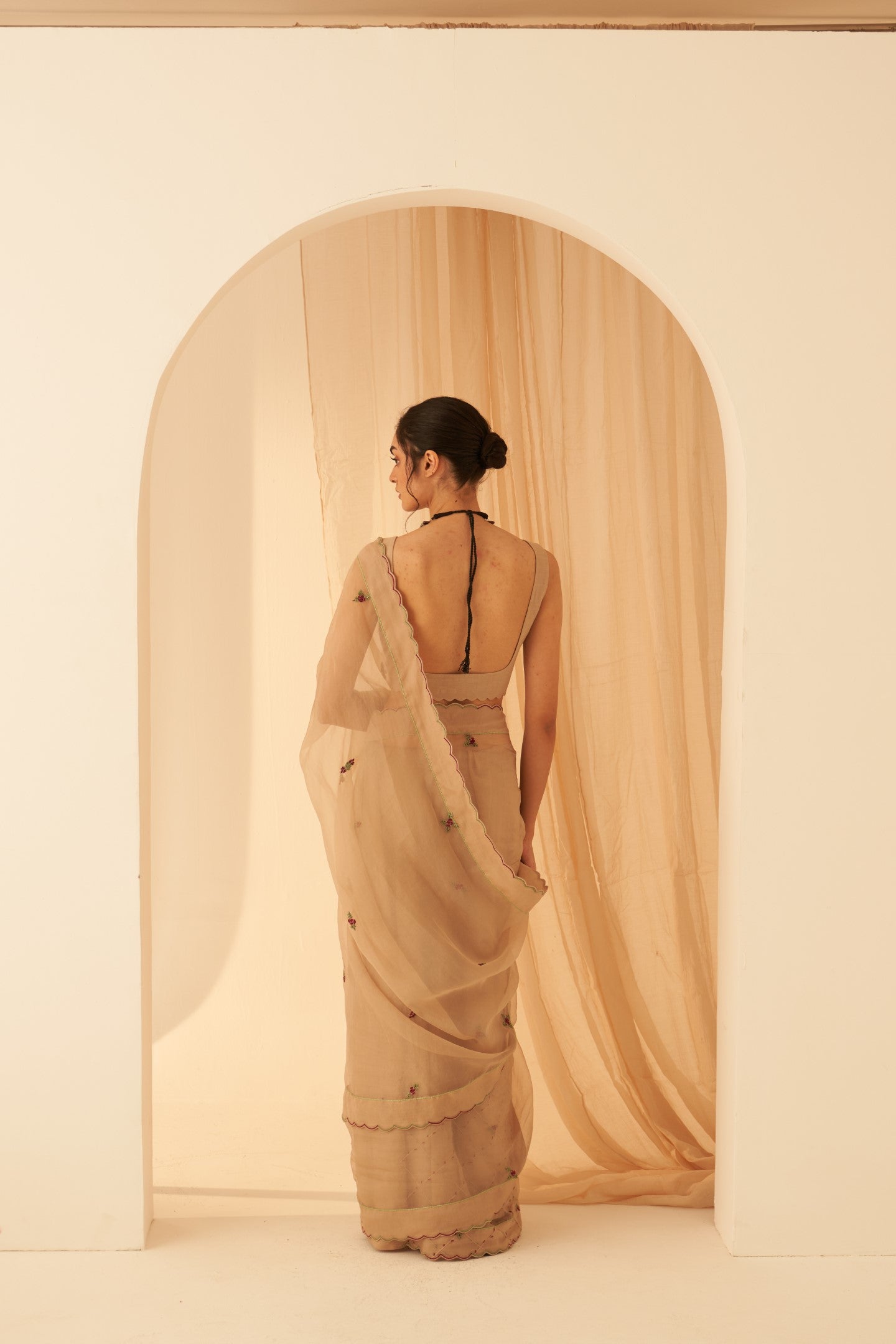 Champagne organza zardozi & elegant resham jaal work saree paired with an organic cotton stitched petticoat