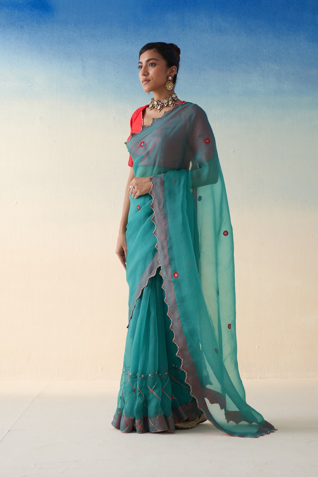 Turquoise organza checkered jaal-embroidered saree comes with an organic cotton stitched petticoat (02 Pcs.)