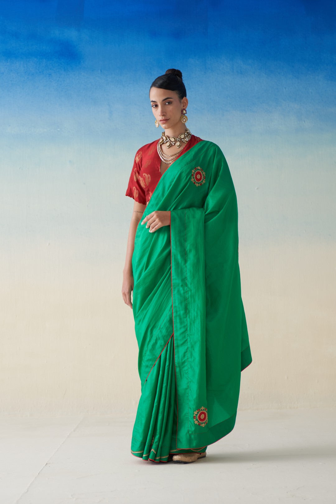 Green silk saree with embroidered motifs comes with an organic cotton stitched petticoat (02 Pcs.)