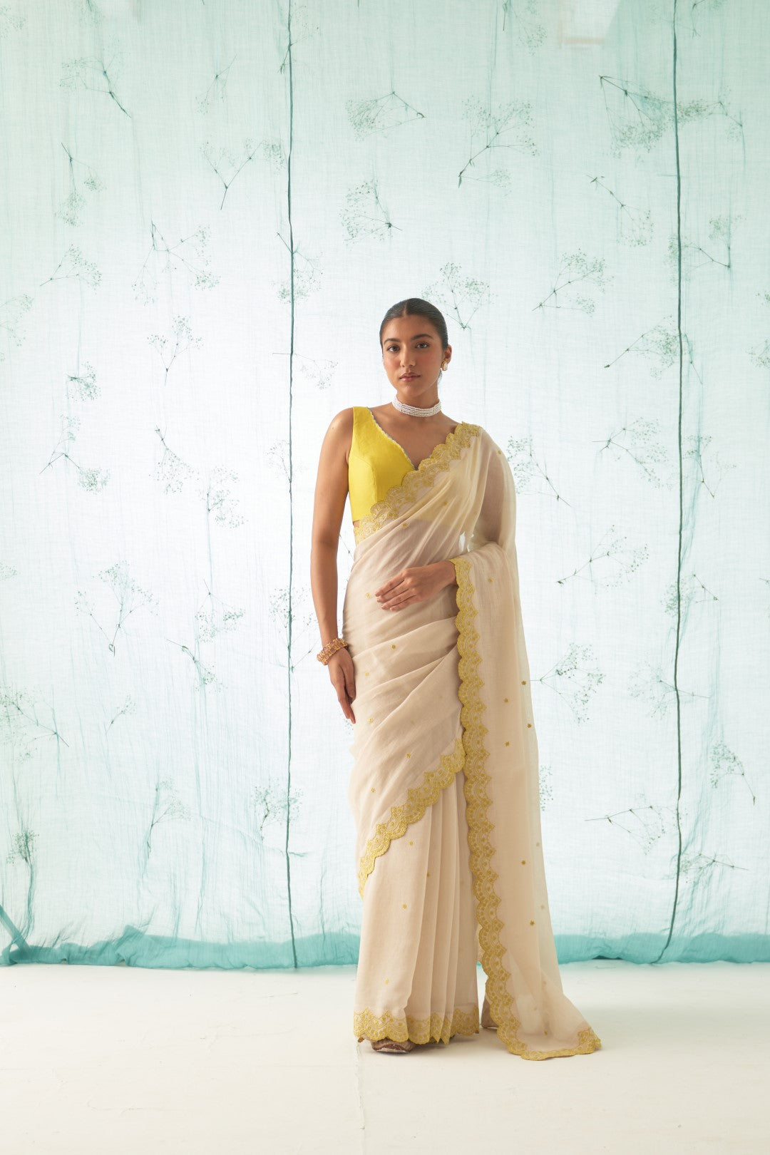 Ivory Chanderi Saree Set with Yellow Scallop Border, Stitched Blouse, and Organic Cotton Petticoat – A Classic Choice in Chanderi Sarees