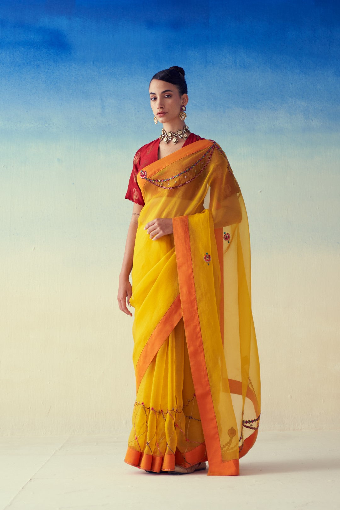 Yellow organza embroidered saree comes with an organic cotton petticoat (02 Pcs.)