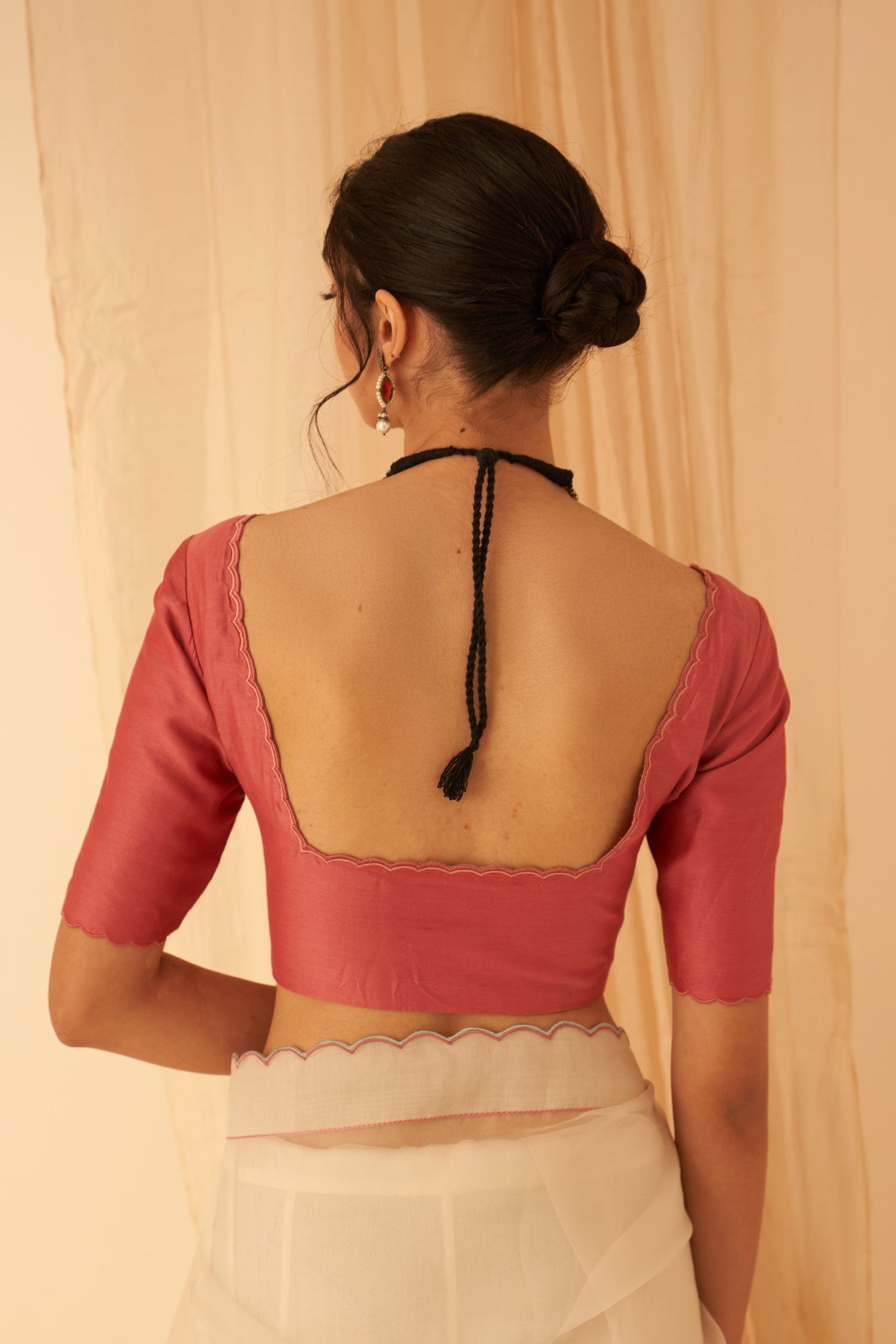 Pink chanderi blouse with scallop work on necline and sleeves edges