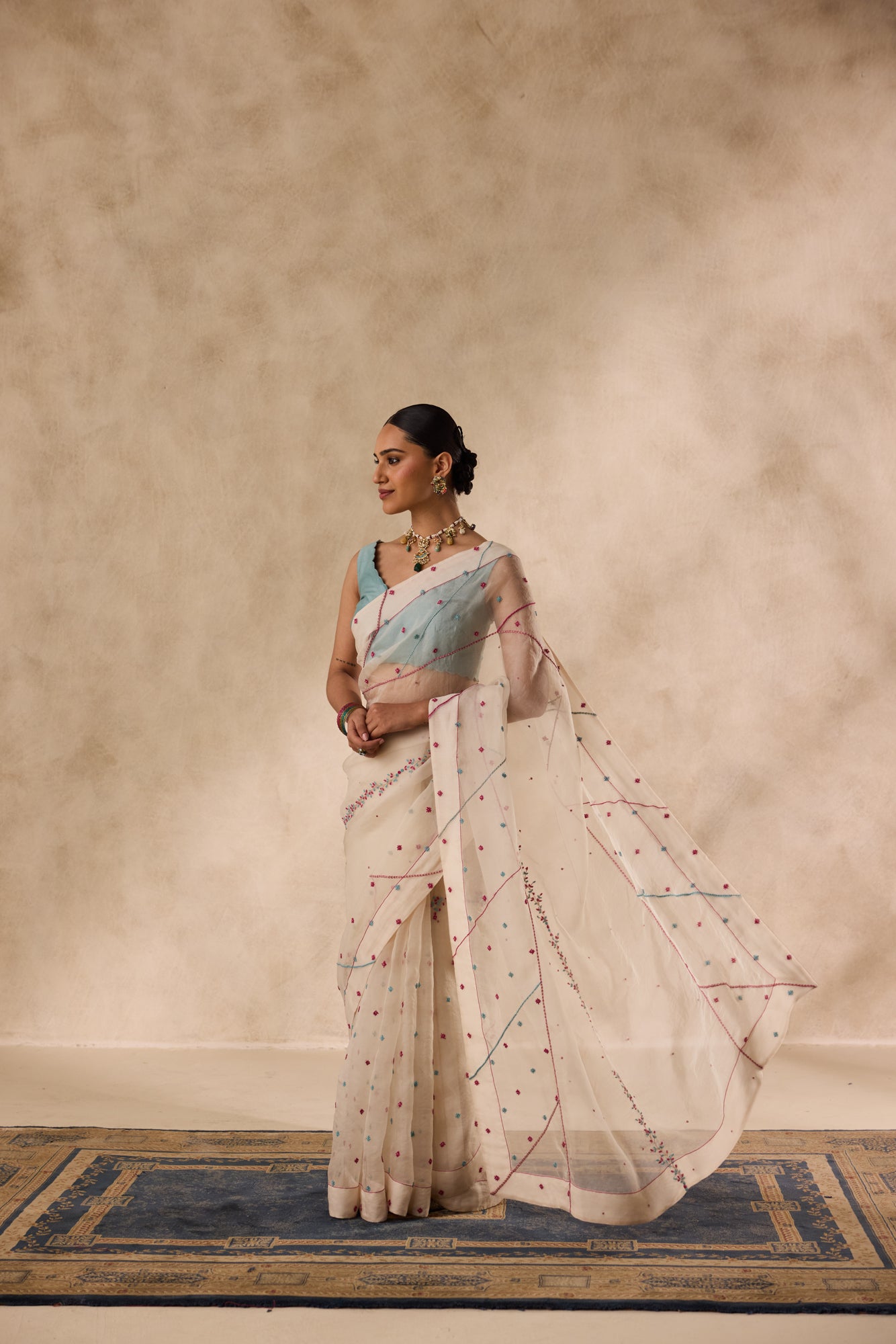 Ivory organza french knot cross stitch embroidered saree comes with unstitched & unembroidered blouse fabric in chanderi