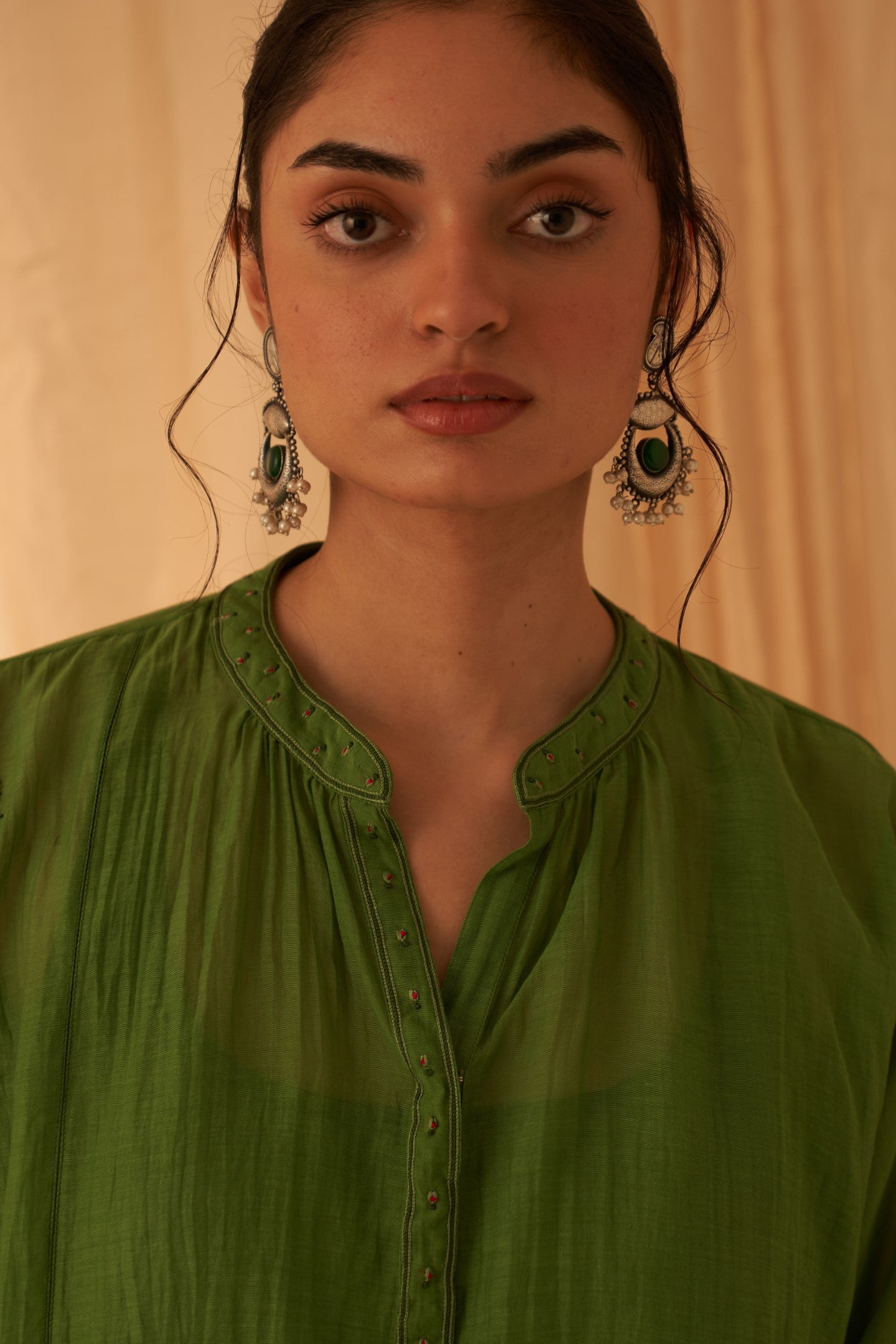 Green chanderi resham buti embroidered tunic paired with cotton slip & salwar