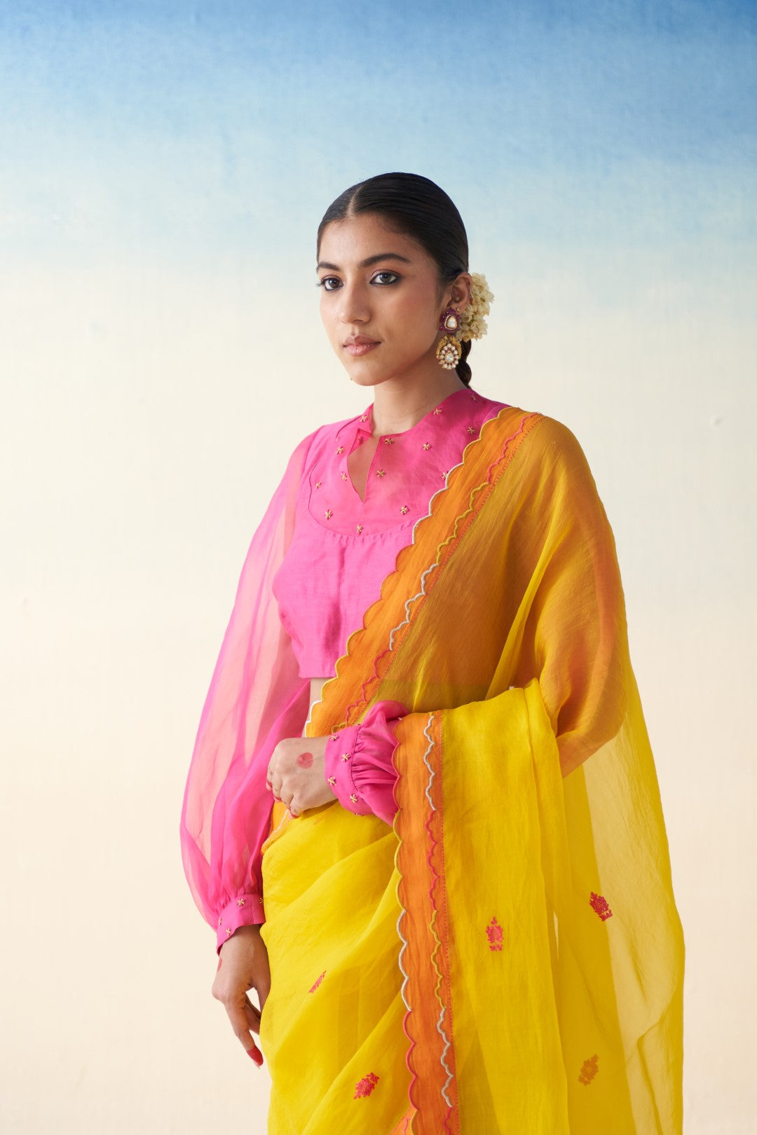 Yellow organza embroidered scallop border saree comes with an organic cotton stitched petticoat (02 Pcs.)