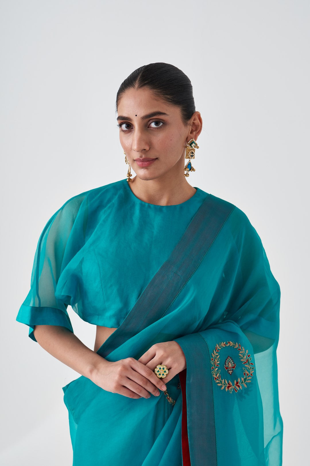 Turquoise Organza Embroidered Saree Paired with Organic Cotton Stitched Petticoat (02 pcs.)