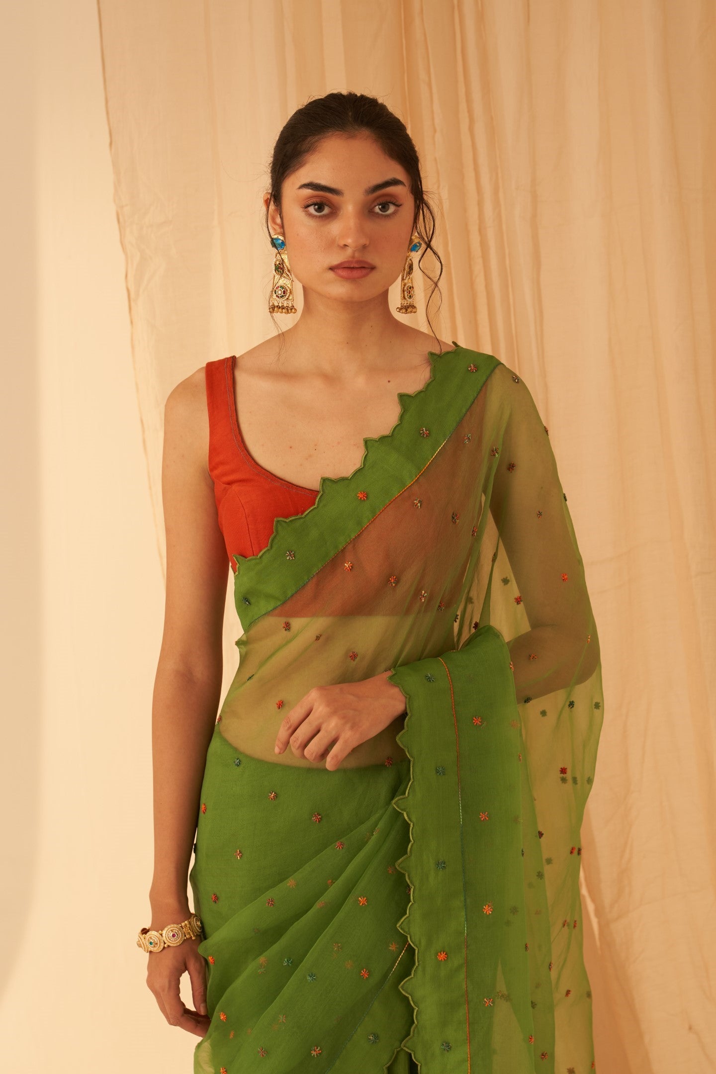 Green chanderi-organza  embroidered with cross taanka work, scalloped border saree paired with an organic cotton stitched petticoat