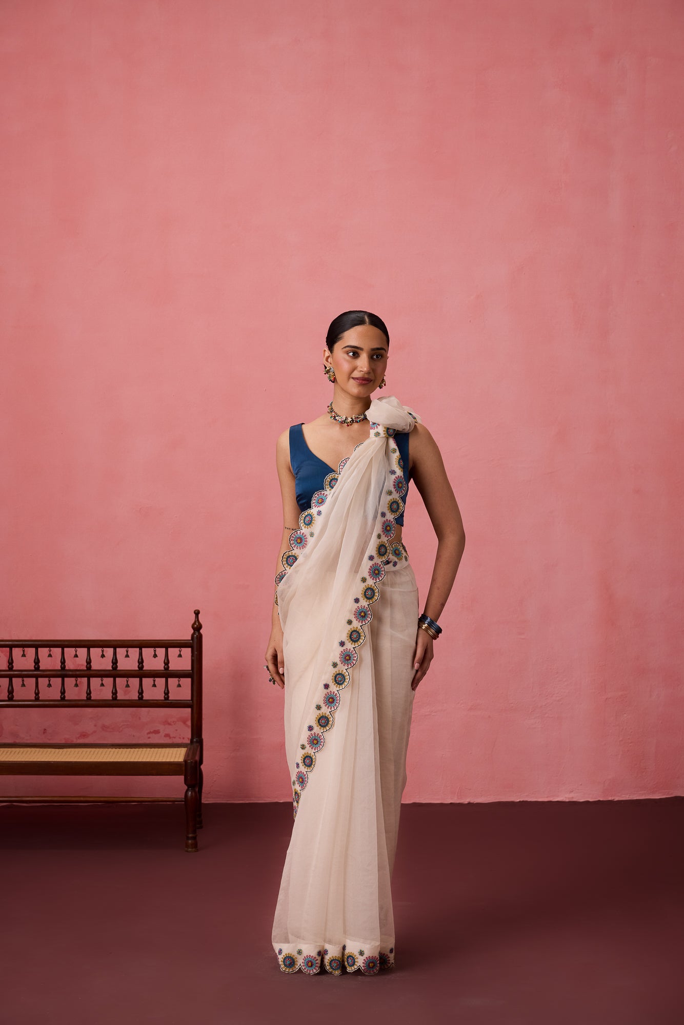 Ivory organza heavy scalloped cutwork embroidered saree comes with unstitched & unembroidered blouse fabric in chanderi