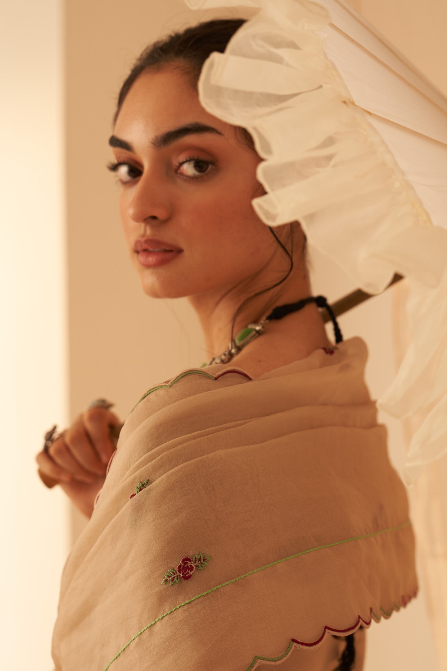 Champagne organza zardozi & elegant resham jaal work saree paired with an organic cotton stitched petticoat