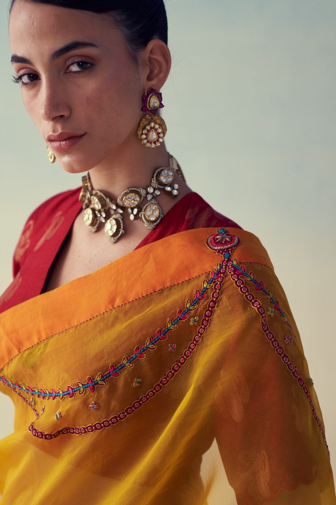 Yellow organza embroidered saree comes with an organic cotton petticoat (02 Pcs.)