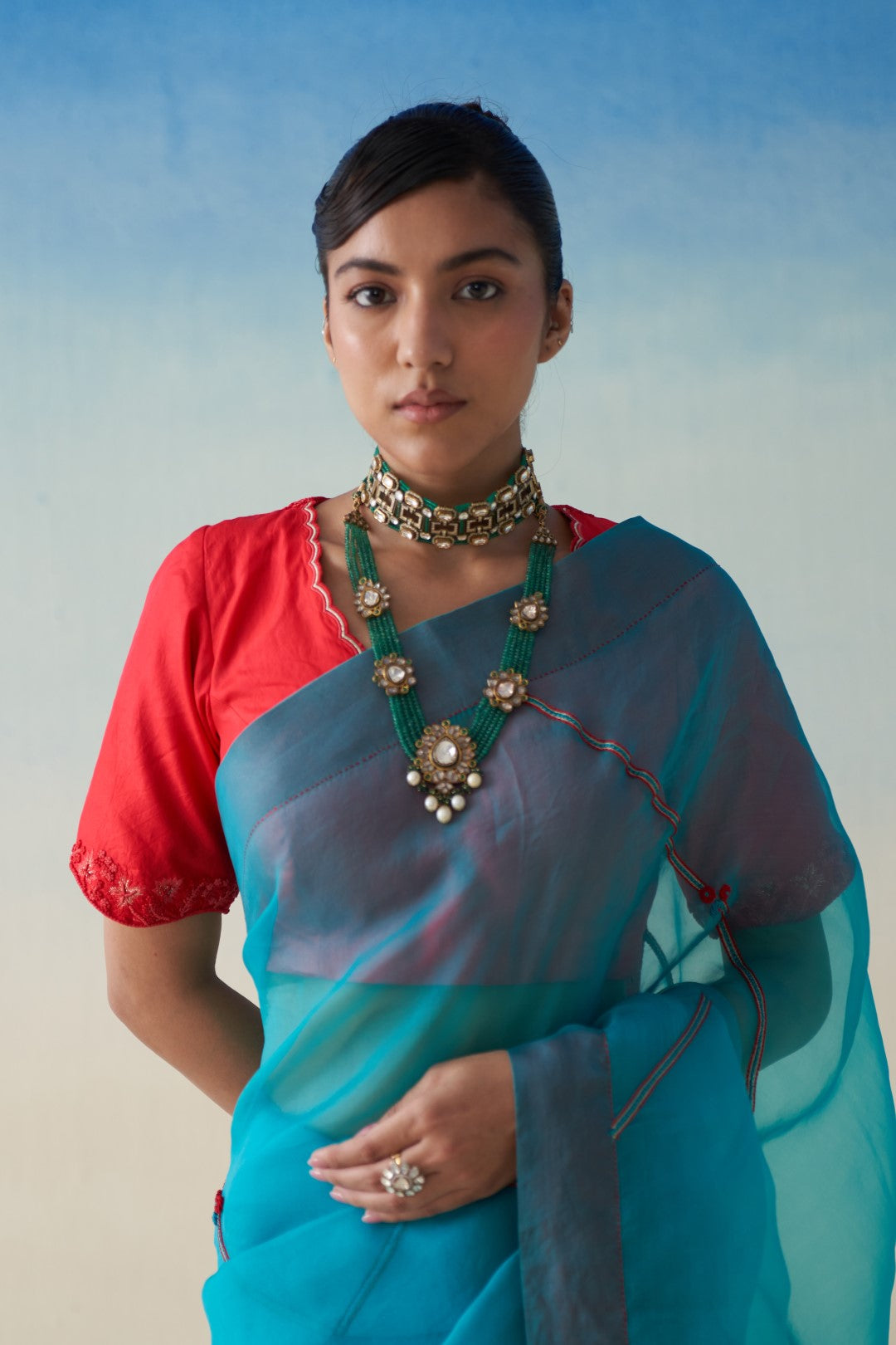 Turquoise organza embroidered saree comes with an organic cotton stitched petticoat (02 Pcs.)