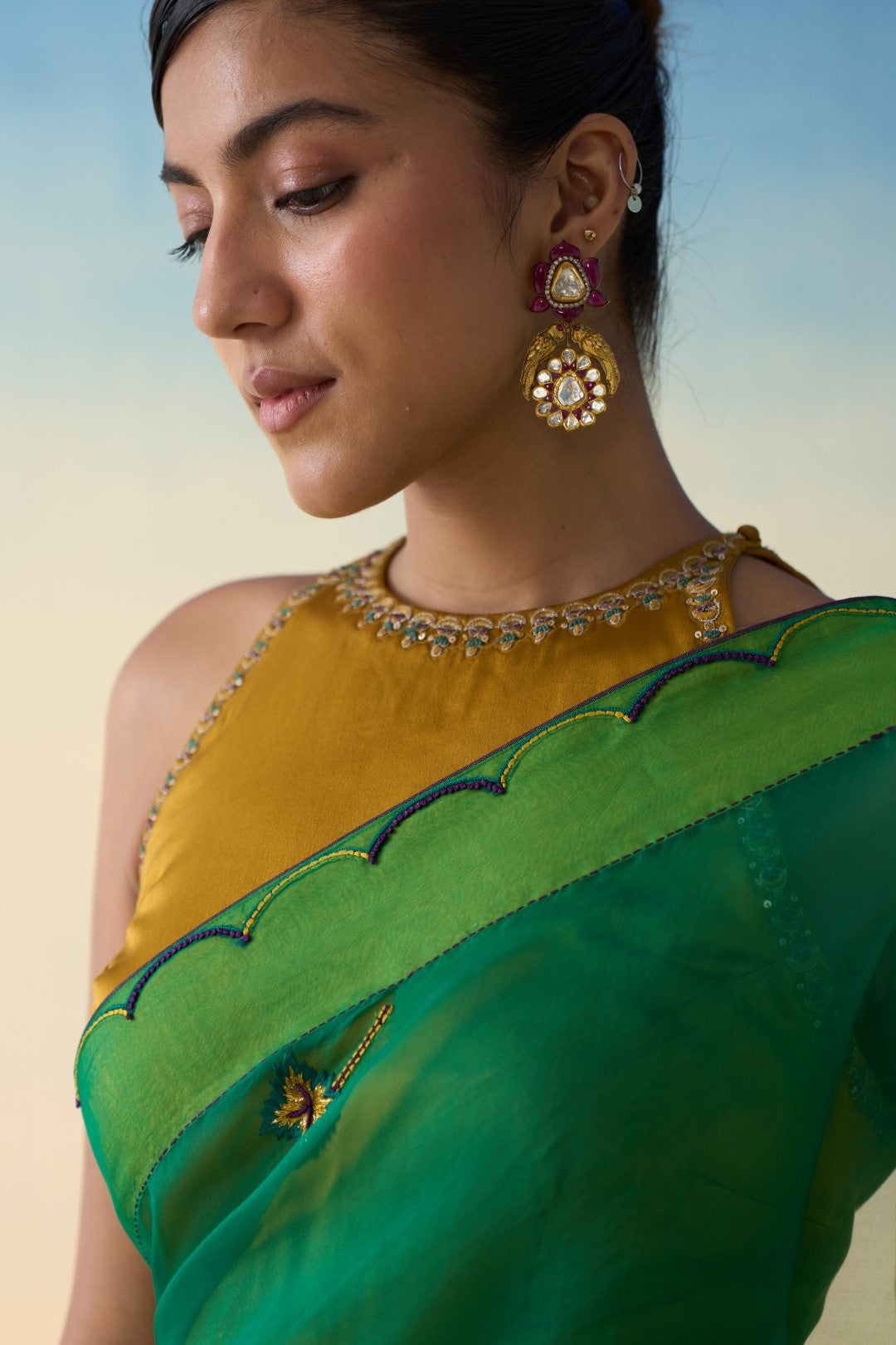 Green organza embroidered & scallop border saree comes with an organic cotton petticoat. (02 Pcs.)