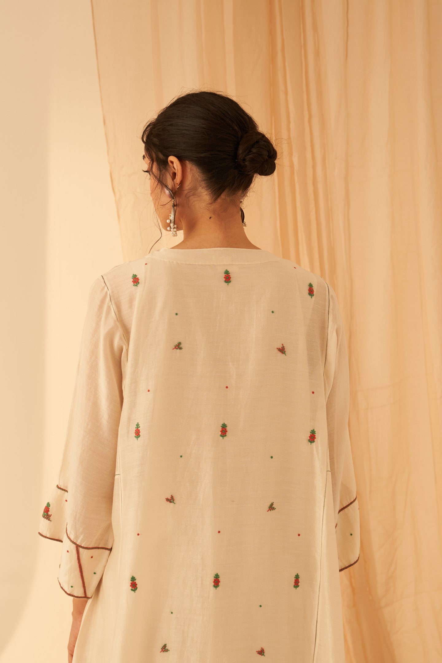 Ivory Chanderi kurta paired with cotton slip, salwar & organza dupatta