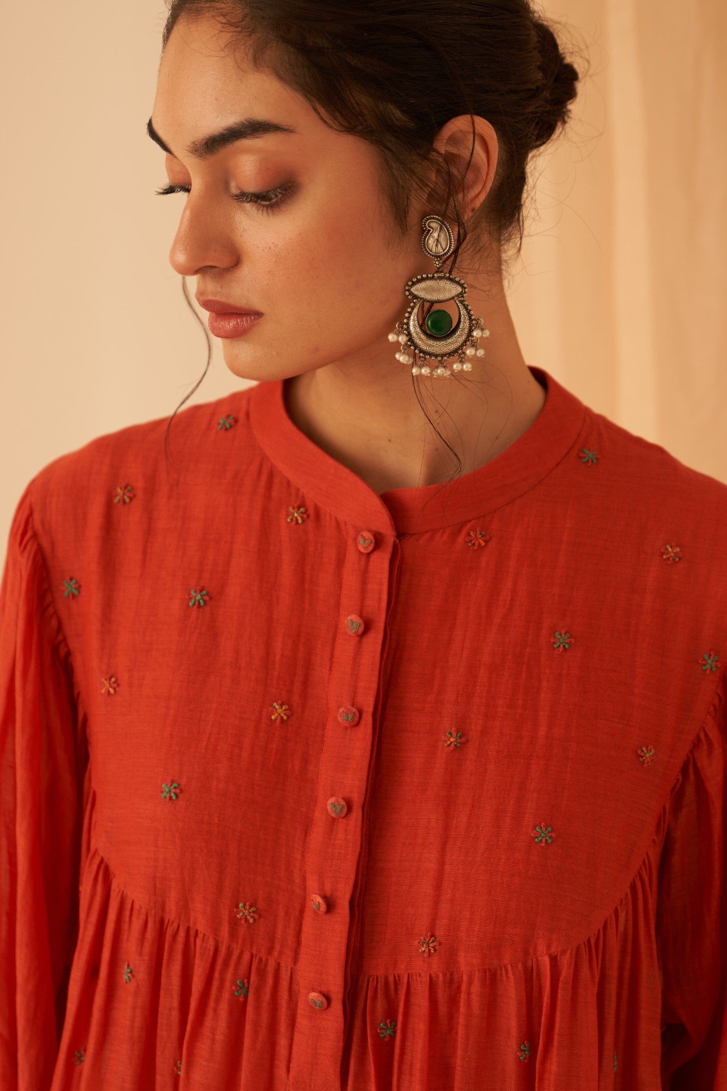 Rust chanderi cross stitch embroidered kurta paired with cotton slip, pant & chanderi dupatta