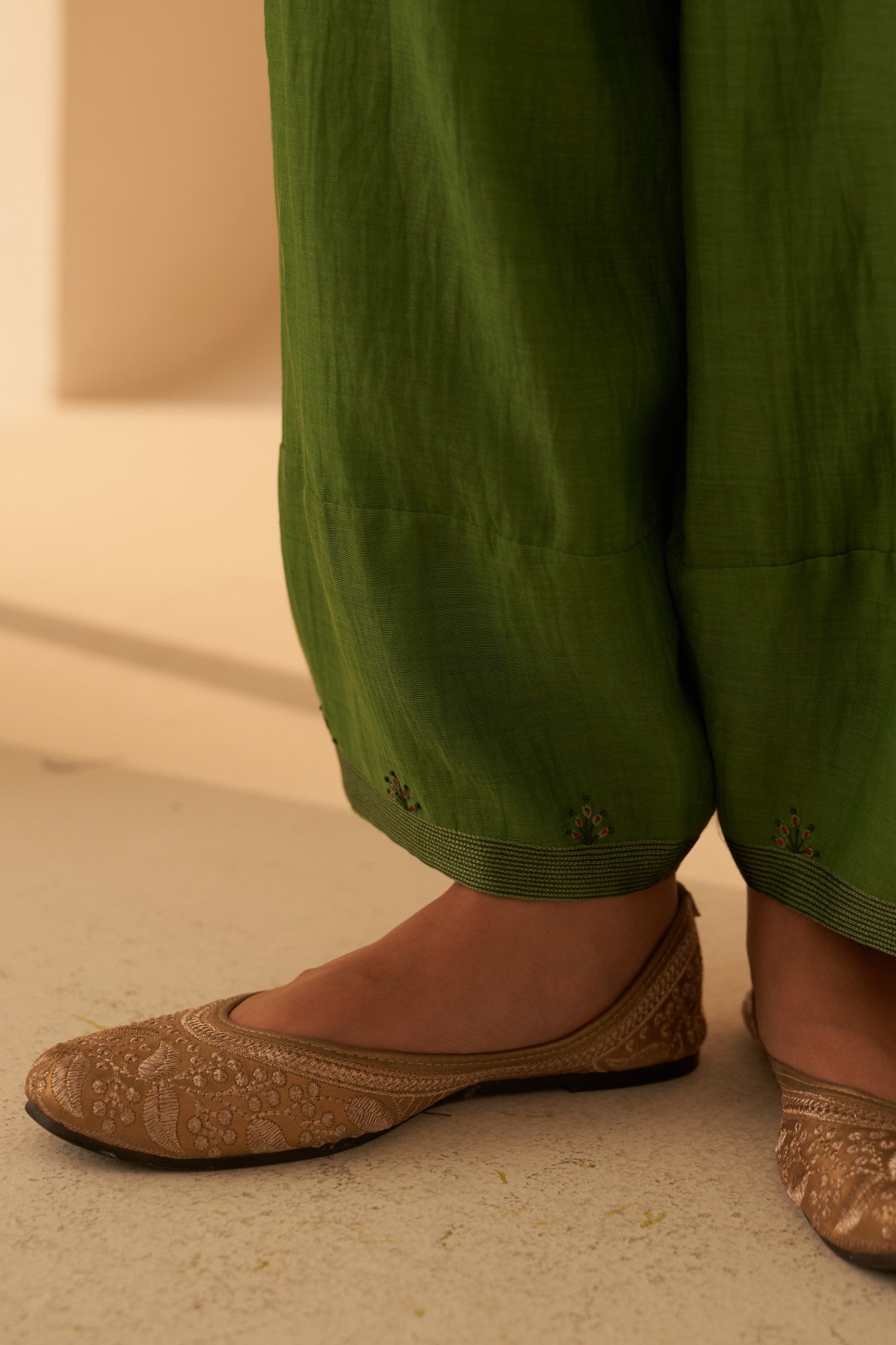 Green chanderi resham buti embroidered tunic paired with cotton slip & salwar