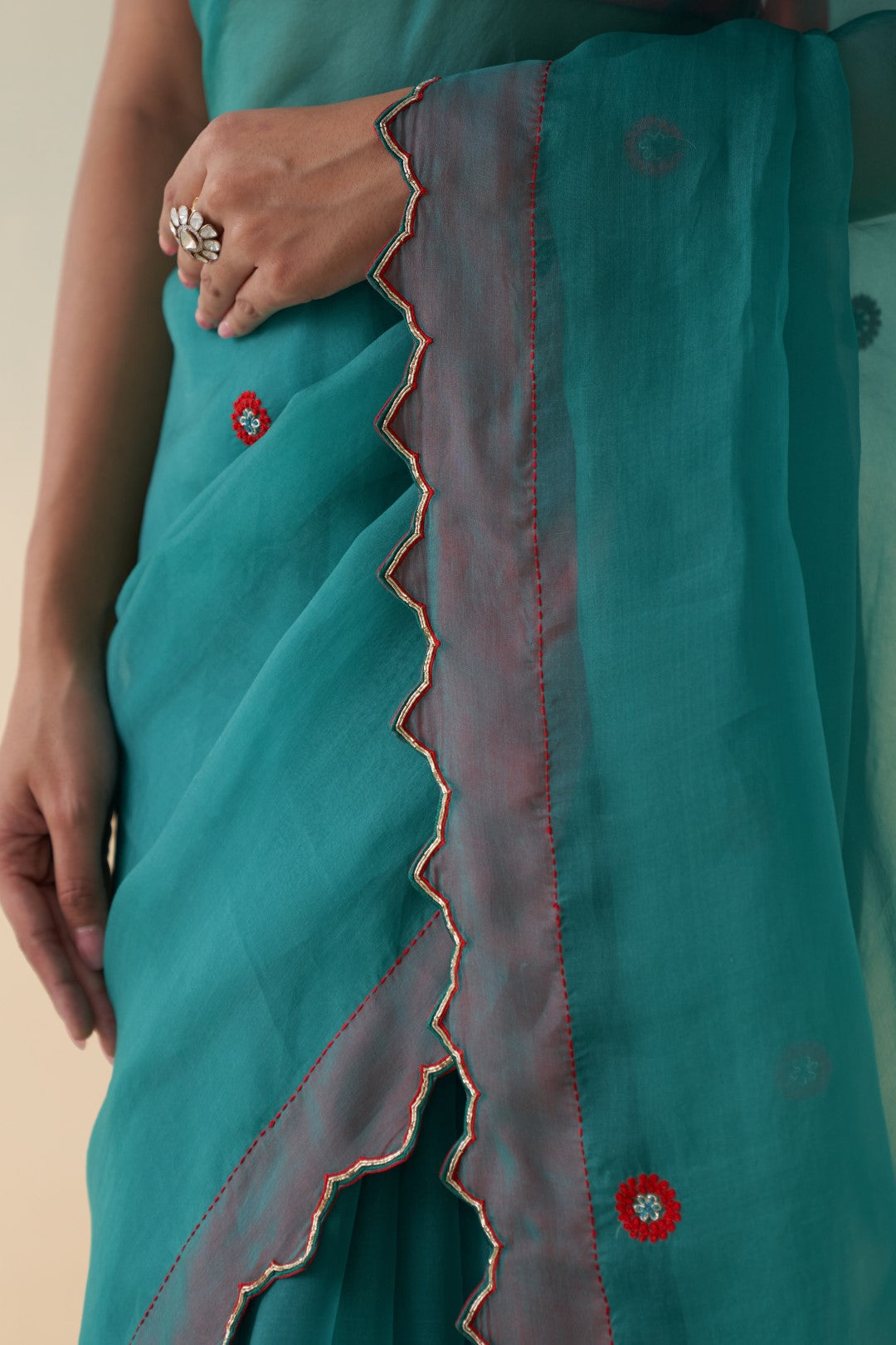 Turquoise organza checkered jaal-embroidered saree comes with an organic cotton stitched petticoat (02 Pcs.)