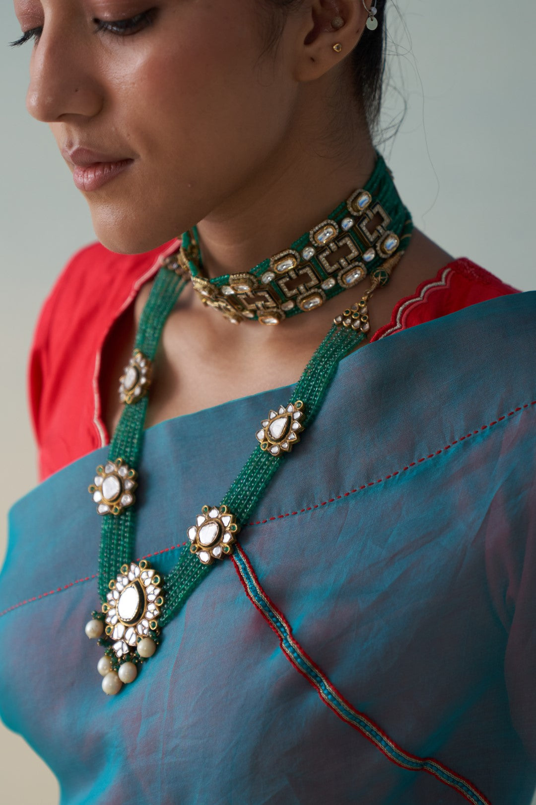 Turquoise organza embroidered saree comes with an organic cotton stitched petticoat (02 Pcs.)