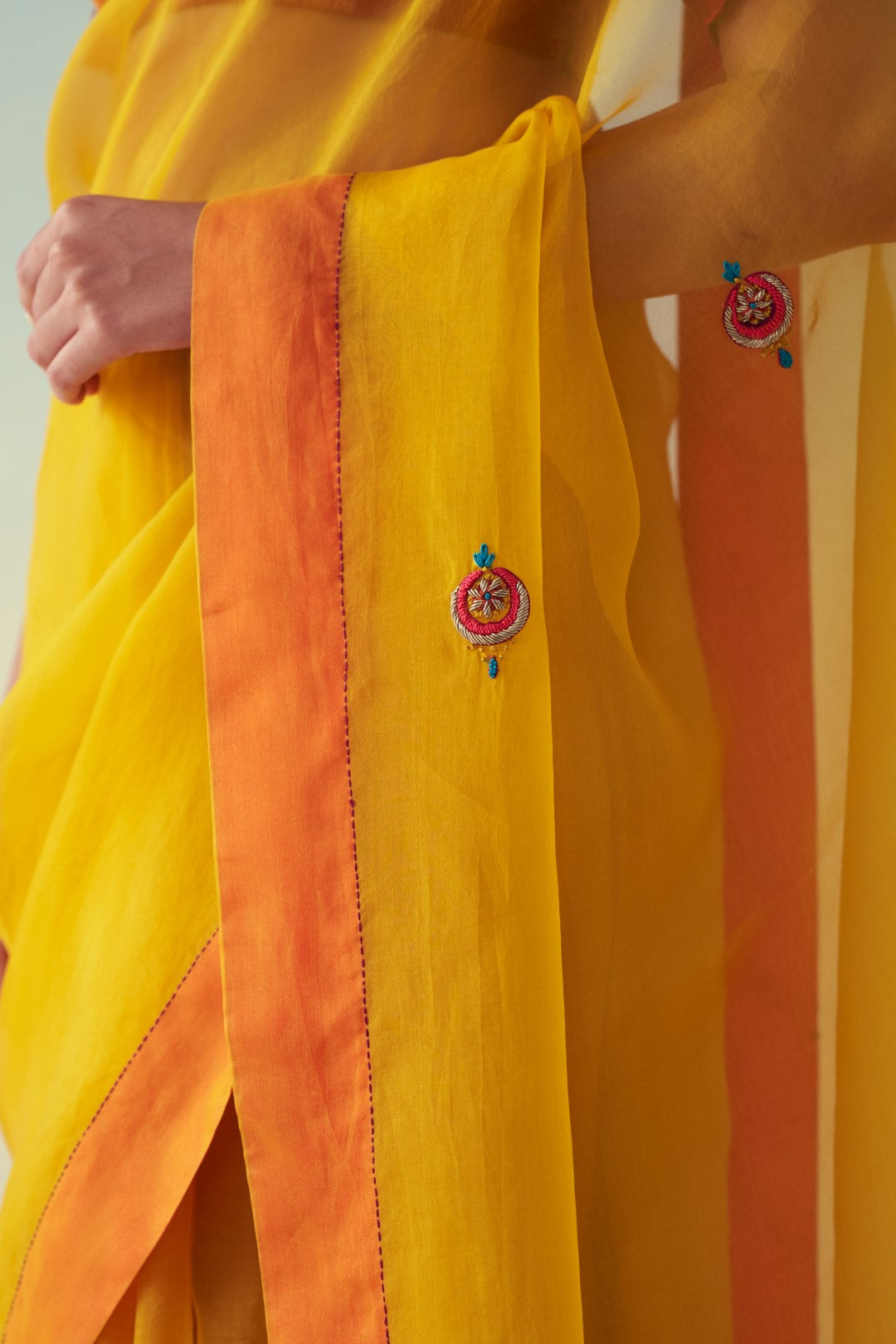 Yellow organza embroidered saree comes with an organic cotton petticoat (02 Pcs.)