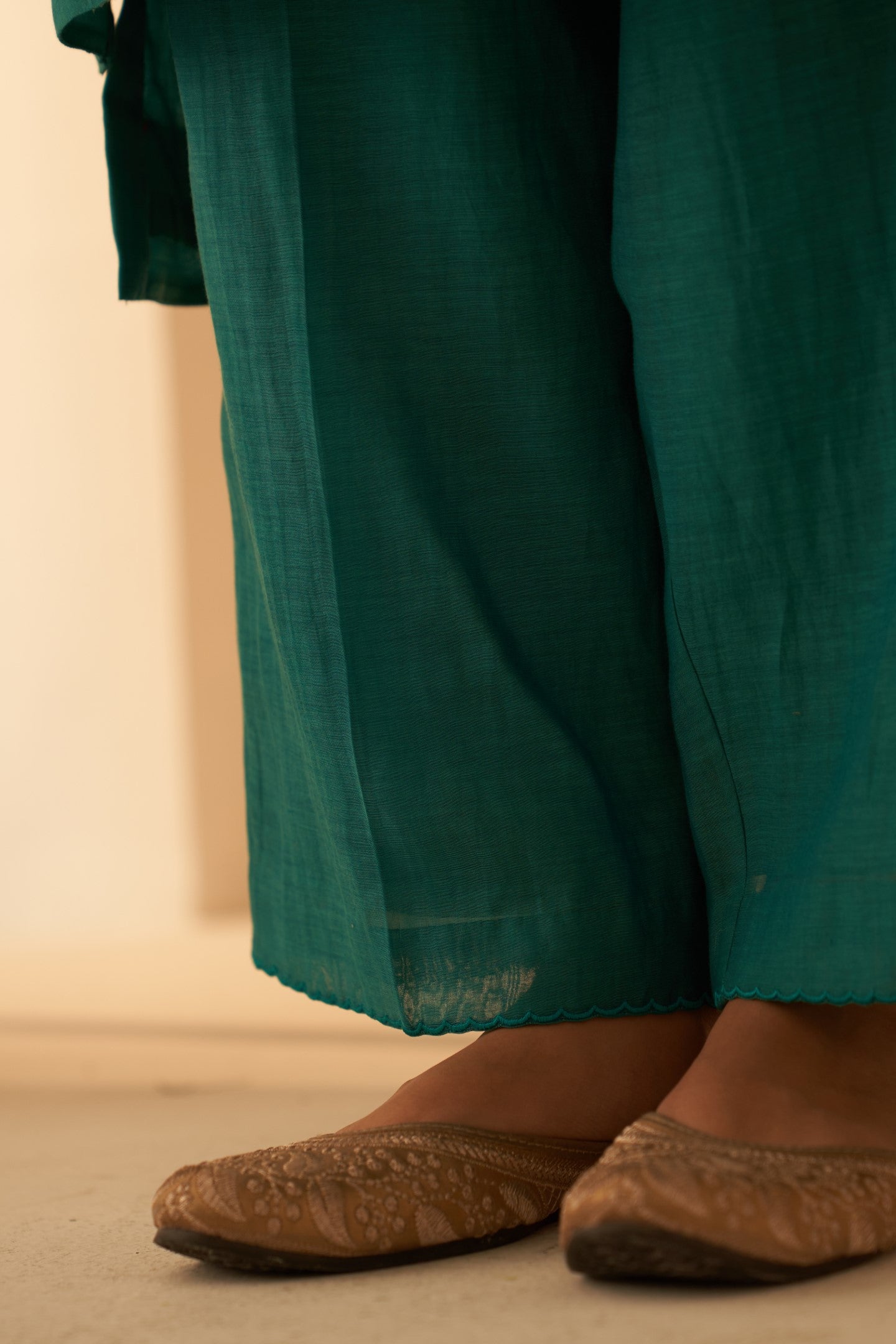 Turquoise chanderi kurta with pintuck box pleats and floral work on sleeves paired with pant & organza dupatta