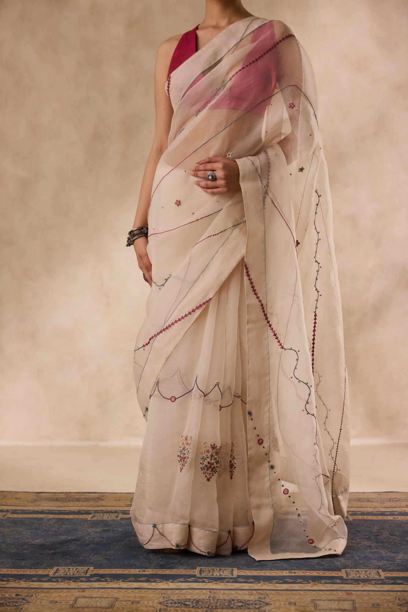 Ivory organza french knot jaal & paisley work saree comes with unstitched & unembroidered blouse fabric in chanderi