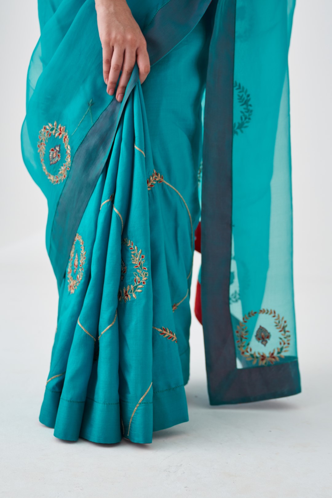 Turquoise Organza Embroidered Saree Paired with Organic Cotton Stitched Petticoat (02 pcs.)