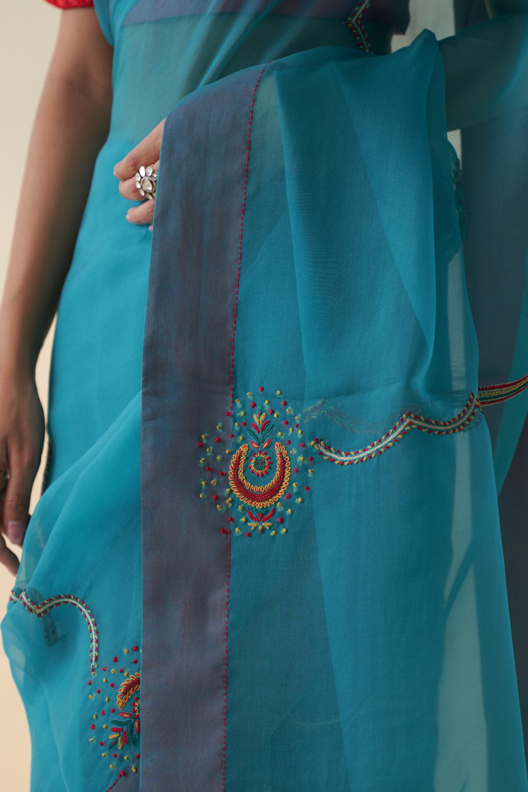 Turquoise organza checkered jaal-embroidered saree comes with an organic cotton stitched petticoat (02 Pcs.)
