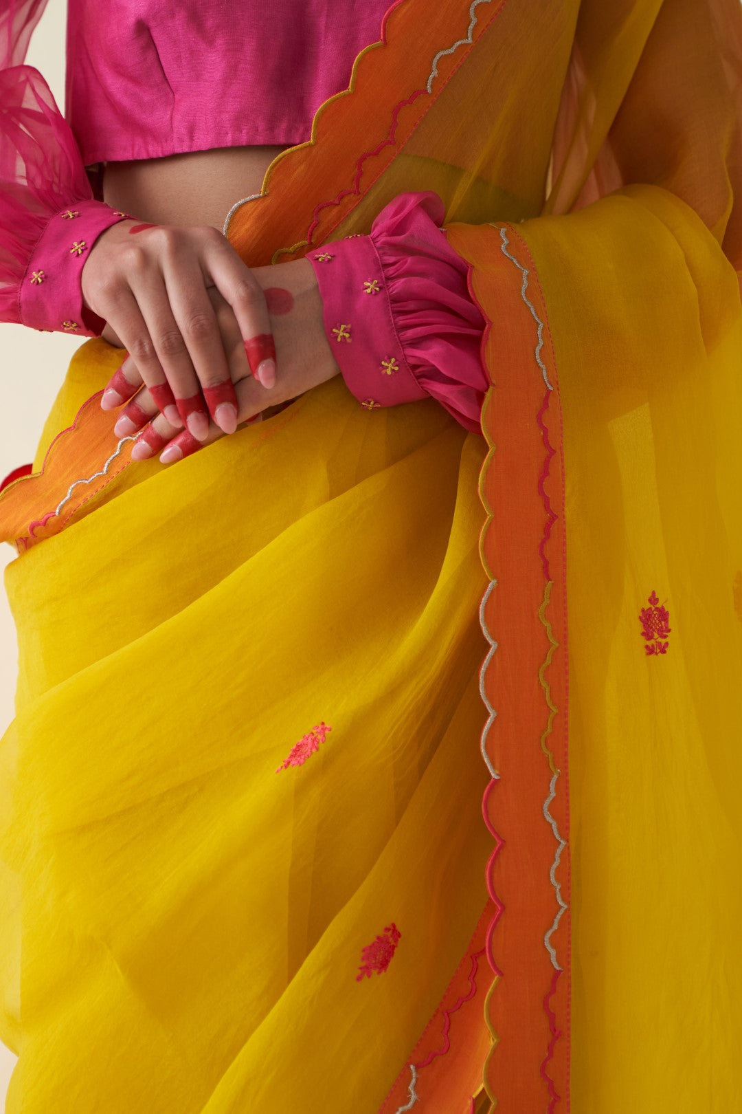 Yellow organza embroidered scallop border saree comes with an organic cotton stitched petticoat (02 Pcs.)