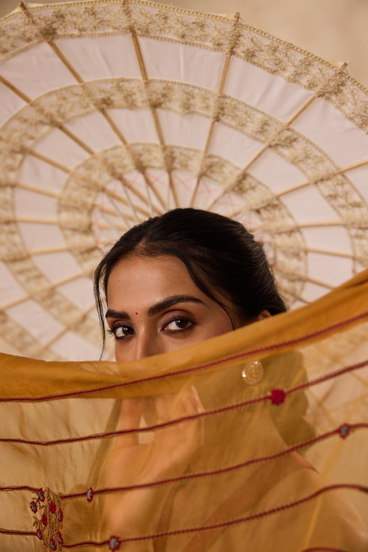 Mustard embroidered organza saree paired with unstitched & unembroidered blouse fabric