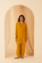 Mustard Chanderi resham buti embroidered tunic paired with cotton slip & Salwar