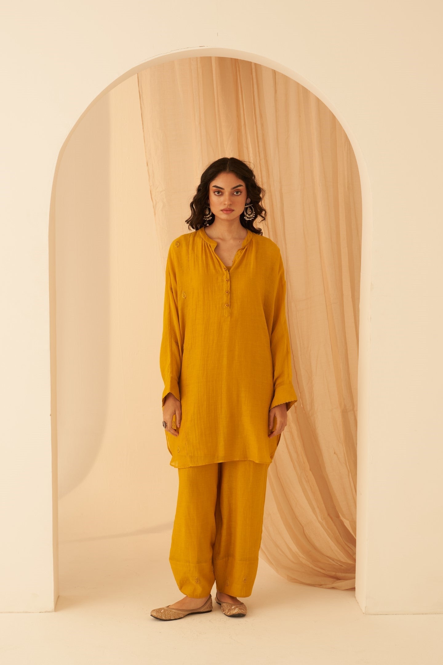 Mustard Chanderi resham buti embroidered tunic paired with cotton slip & Salwar