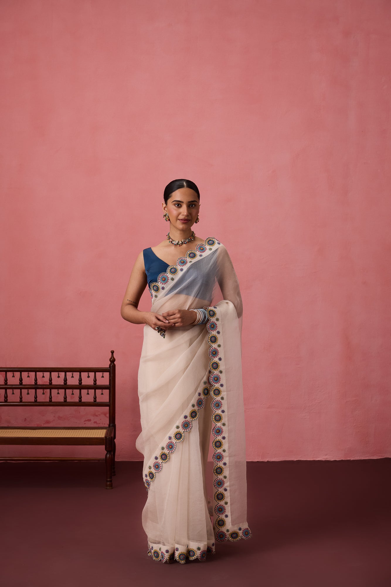 Ivory organza heavy scalloped cutwork embroidered saree comes with unstitched & unembroidered blouse fabric in chanderi