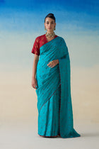 Turquoise silk embroidered saree