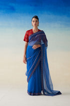 Midnight blue organza embroidered saree paired with blouse fabric