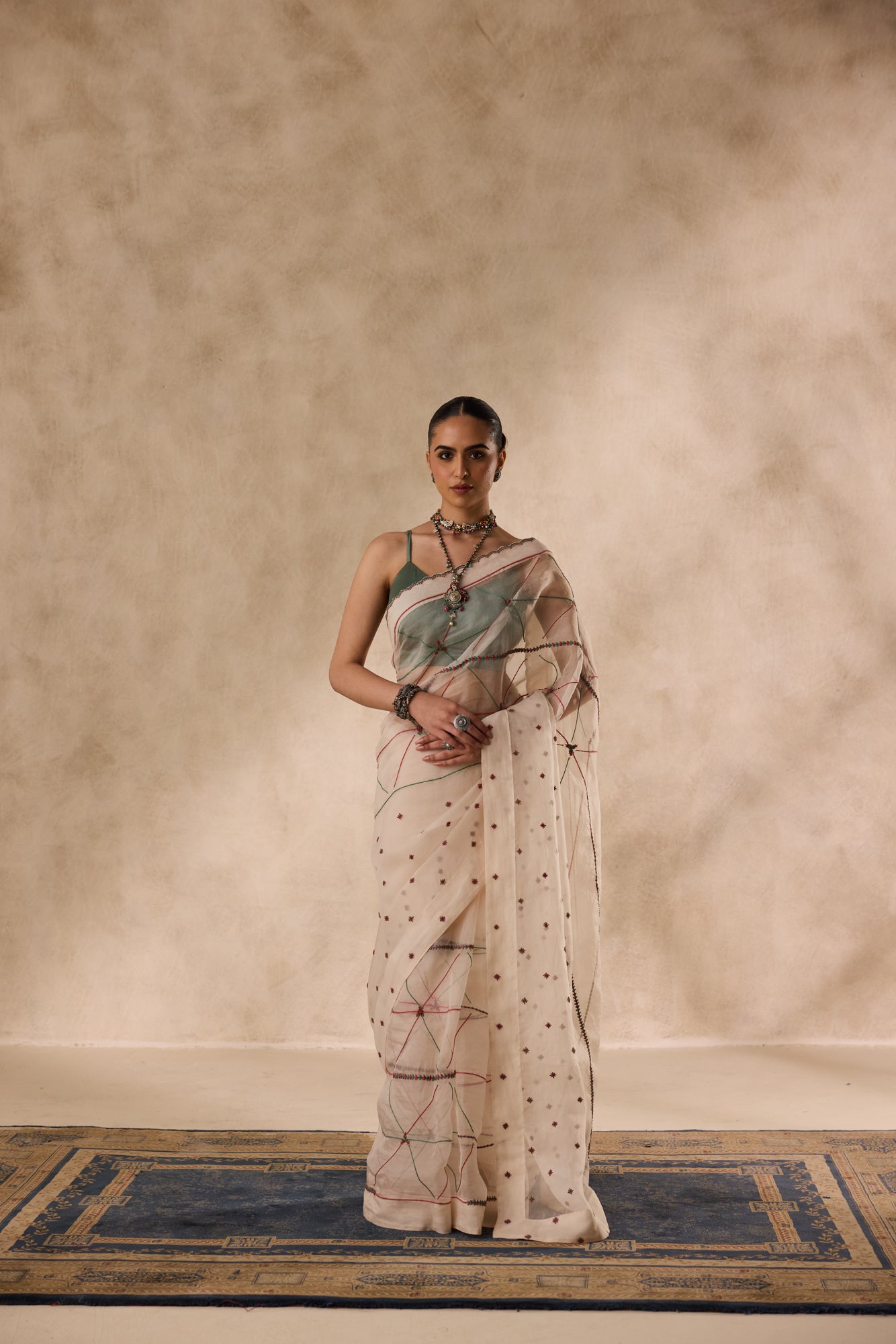 Ivory organza resham and thread embroidered saree comes with unstitched & unembroidered blouse fabric in chanderi