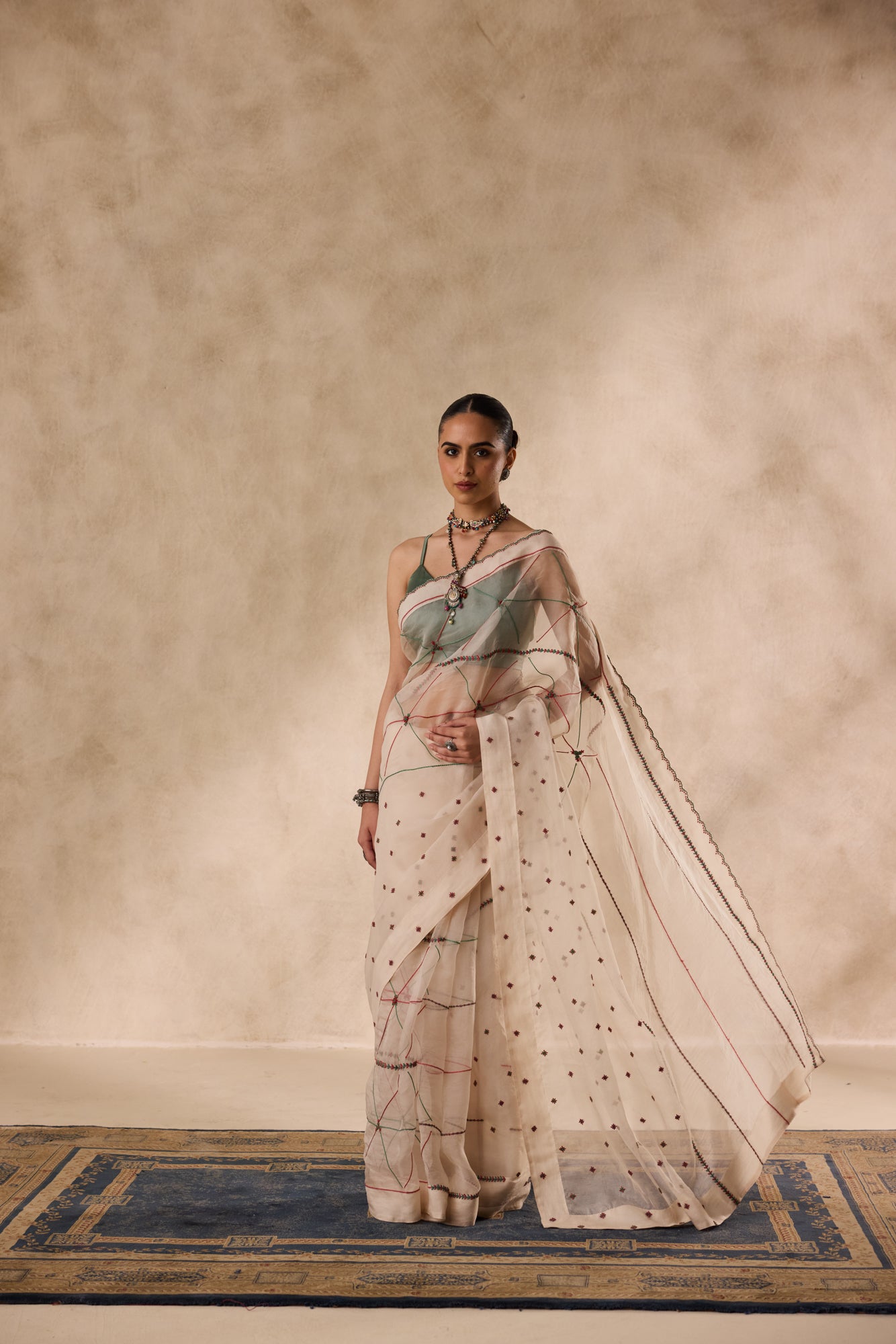 Ivory organza resham and thread embroidered saree comes with unstitched & unembroidered blouse fabric in chanderi