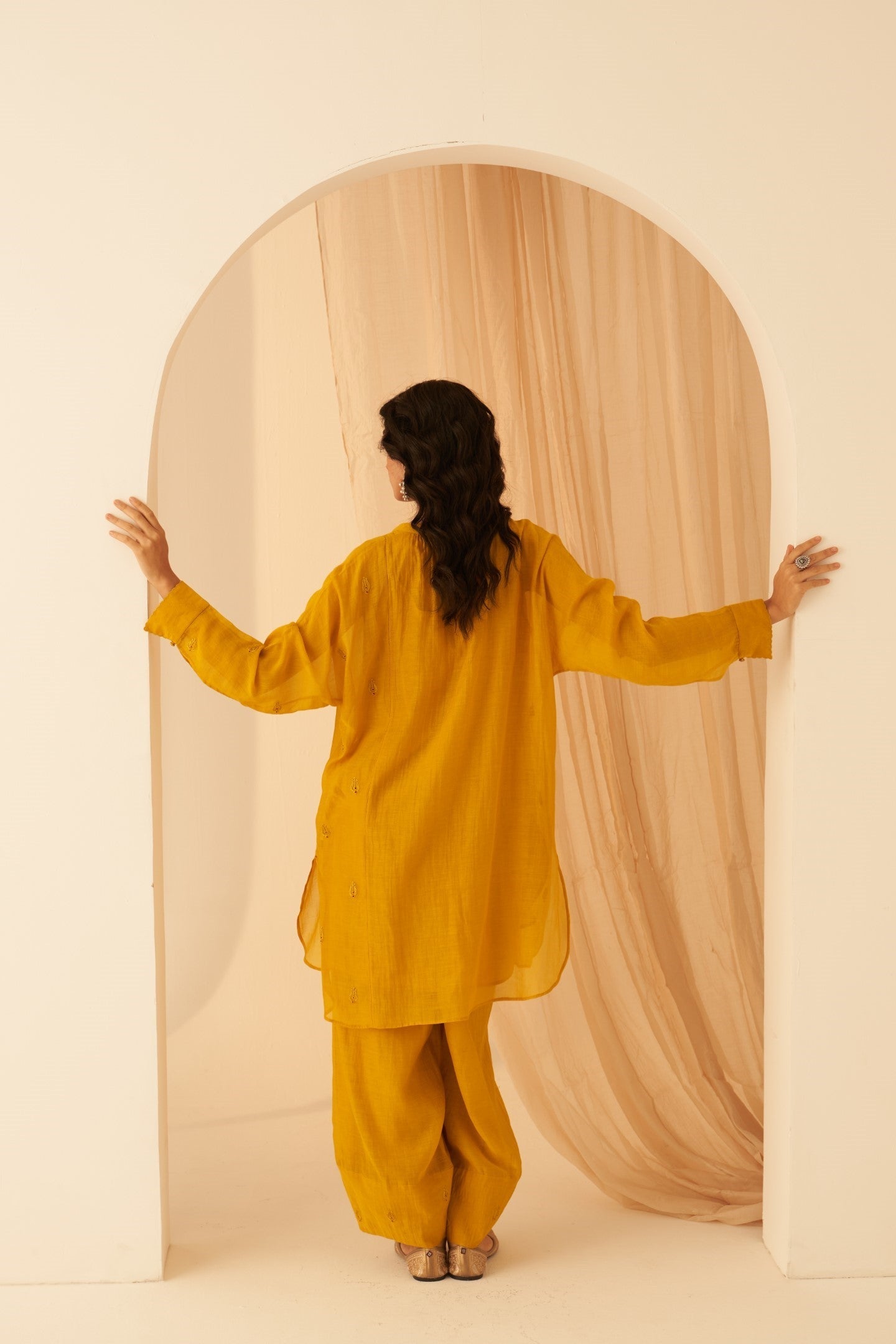 Mustard Chanderi resham buti embroidered tunic paired with cotton slip & Salwar