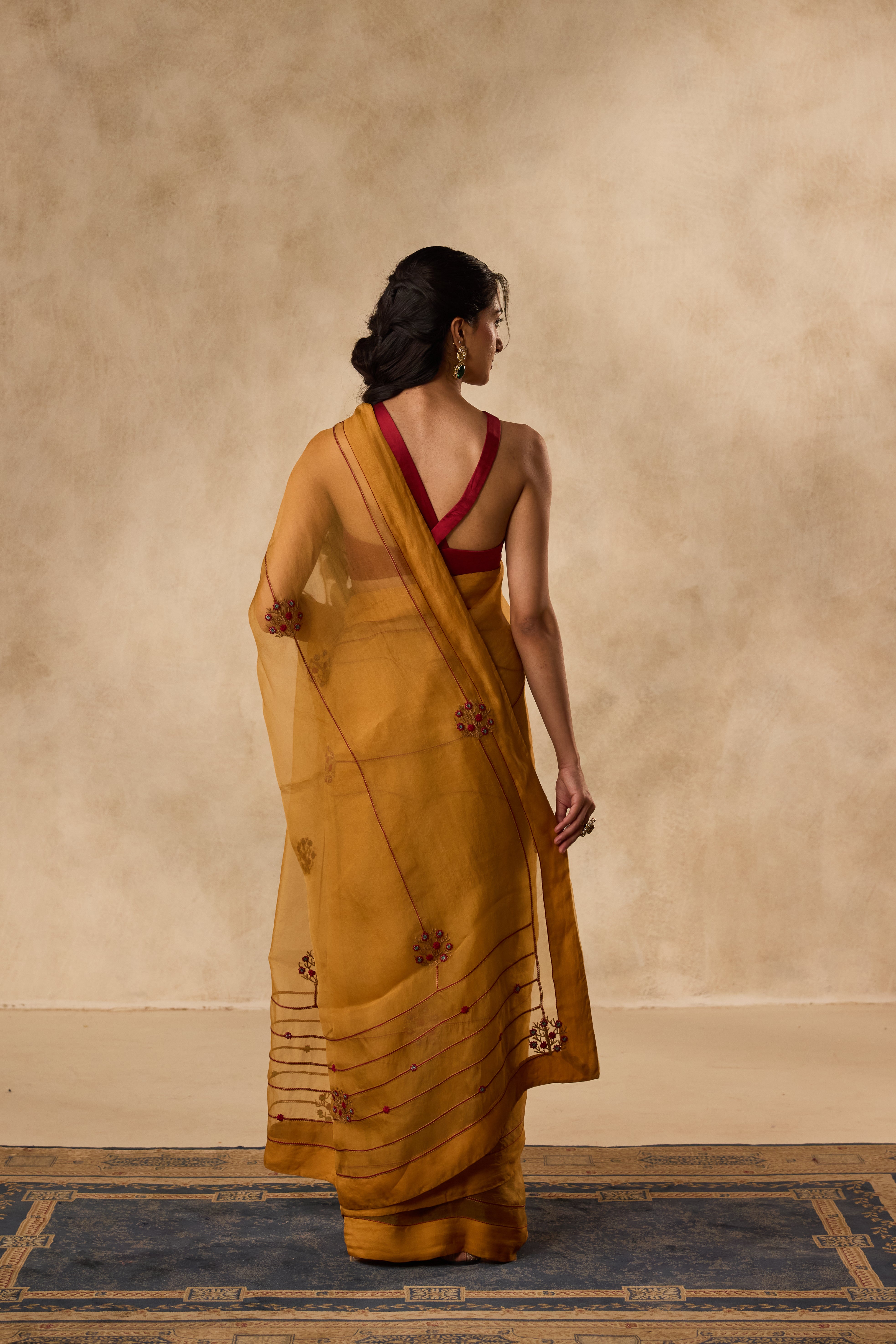Mustard embroidered organza saree  paired with unstitched & unembroidered blouse fabric