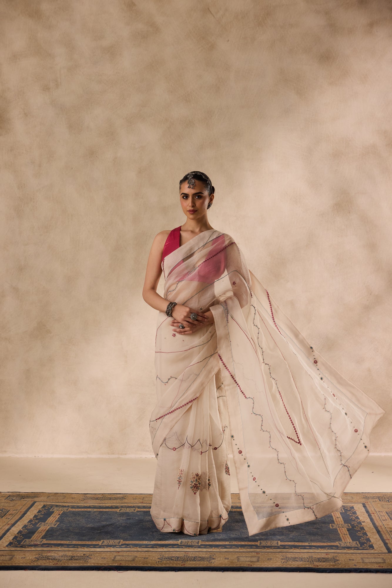 Ivory organza french knot jaal & paisley work saree comes with unstitched & unembroidered blouse fabric in chanderi