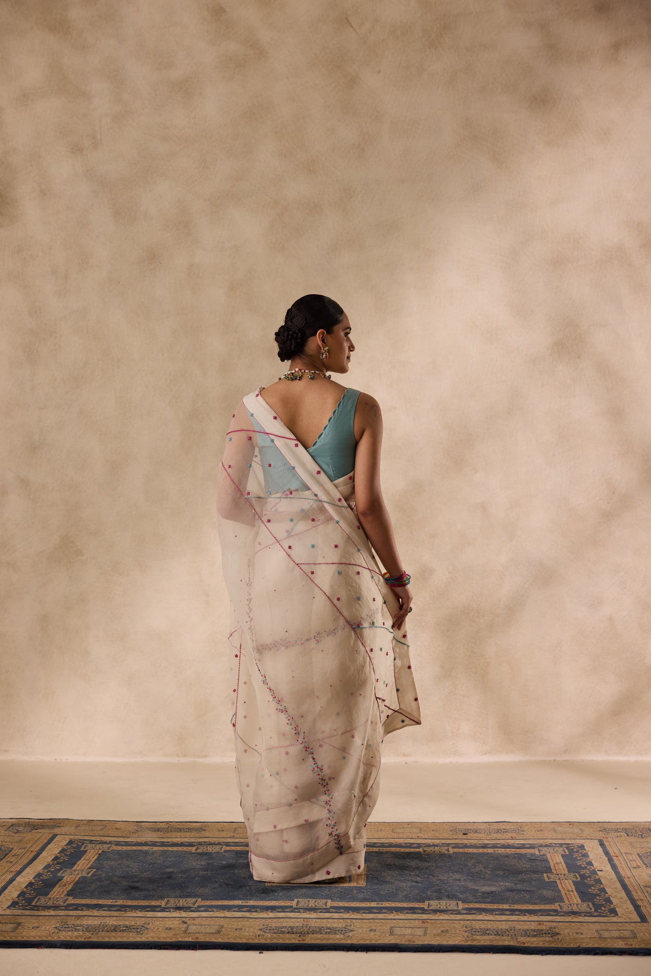 Ivory organza french knot cross stitch embroidered saree comes with unstitched & unembroidered blouse fabric in chanderi