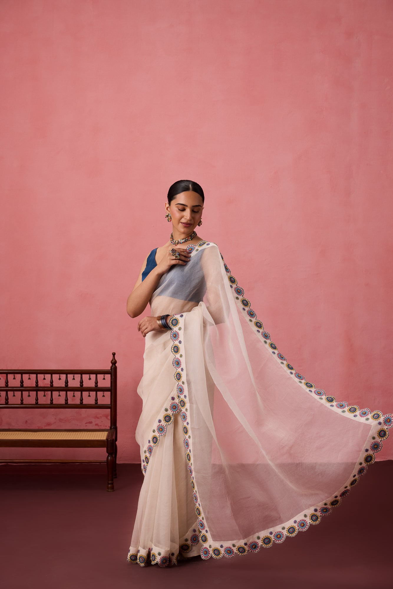Ivory organza heavy scalloped cutwork embroidered saree comes with unstitched & unembroidered blouse fabric in chanderi