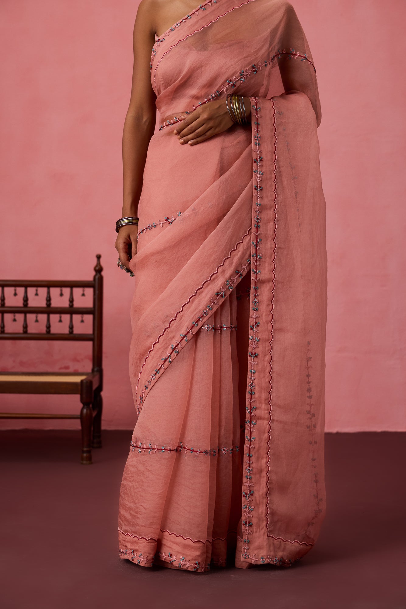 Peach organza embroidered saree comes with unstitched & unembroidered blouse fabric in chanderi