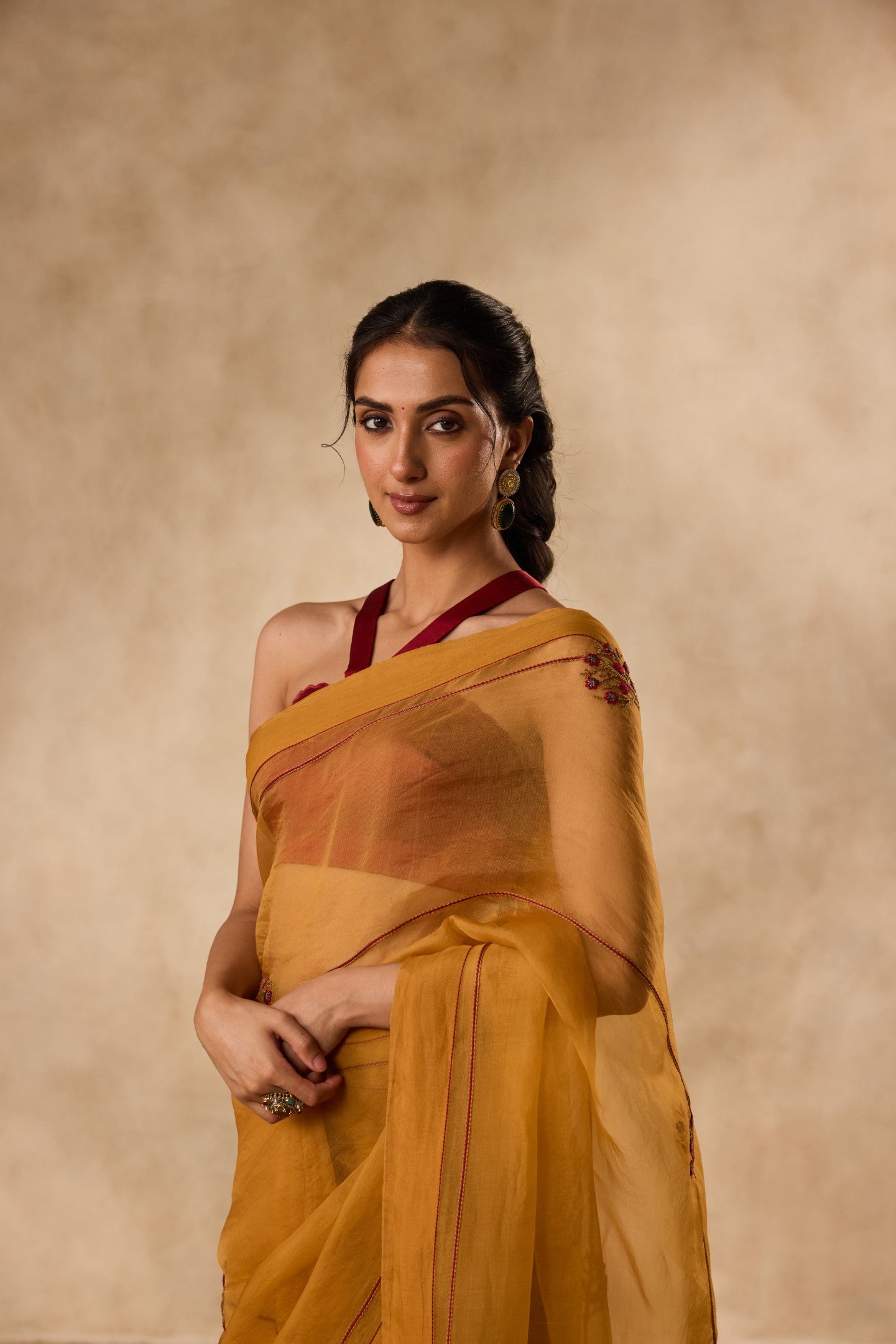 Mustard embroidered organza saree  paired with unstitched & unembroidered blouse fabric