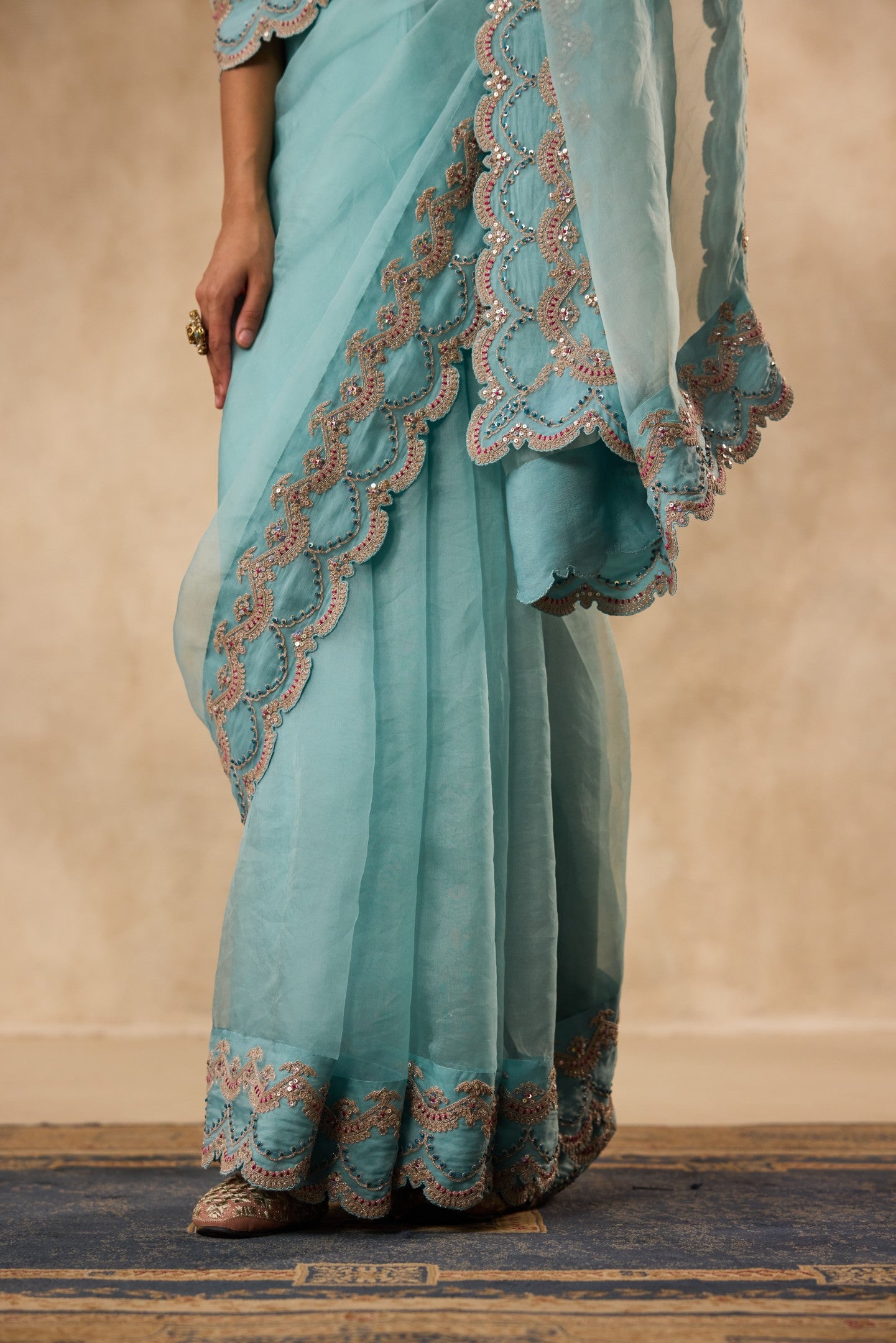 Sky blue dori & sequins embroidered border organza saree  paired with unstitched & unembroidered blouse fabric