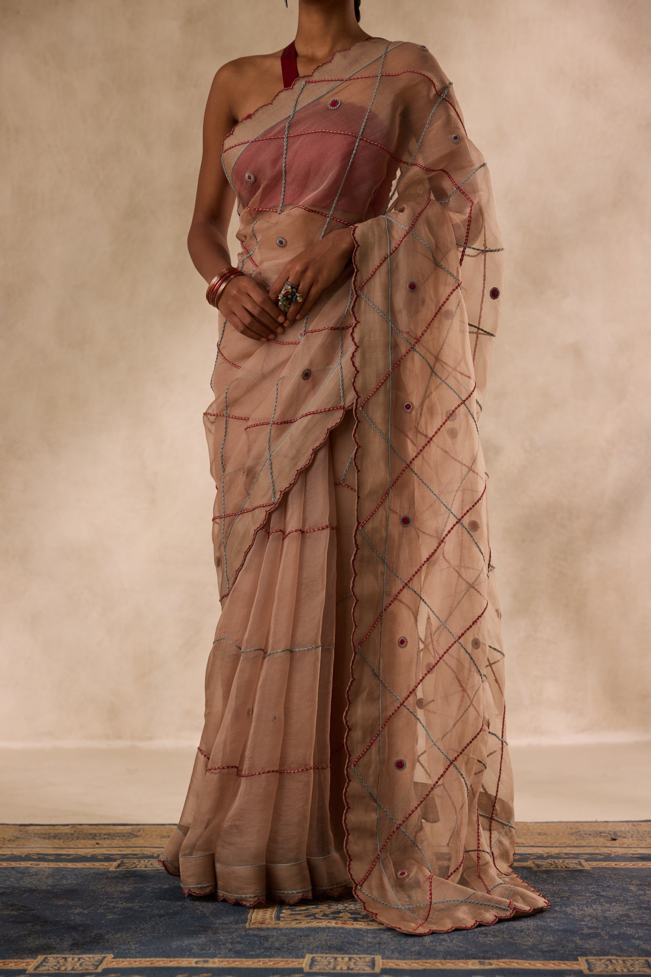 Beige organza jaal embroidered saree comes with unstitched & unembroidered blouse fabric in chanderi